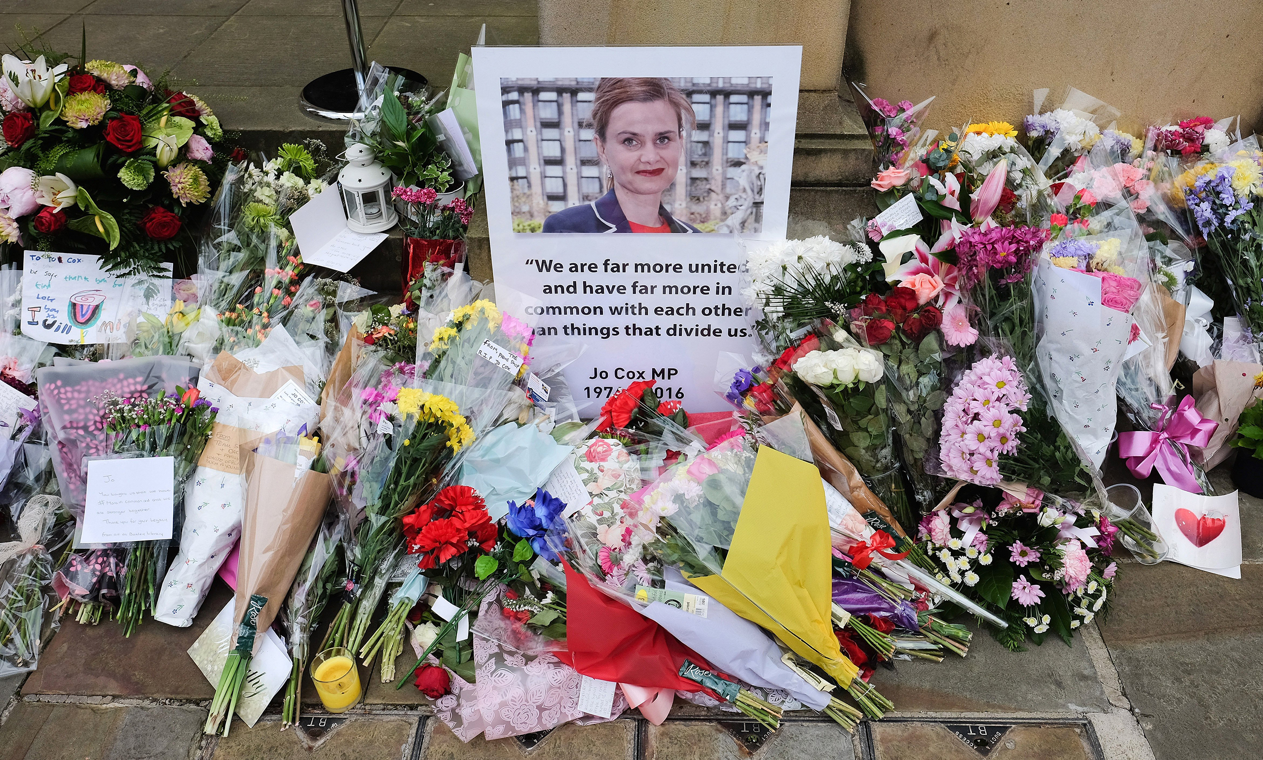Floral tributes and messages are left outside Batley Town Hall ahead of a public event to celebrate the life and 42nd birthday of Labour MP Jo Cox in Batley, U.K., on June 22, 2016. Cox was shot and stabbed in the street on June 16 and later died.