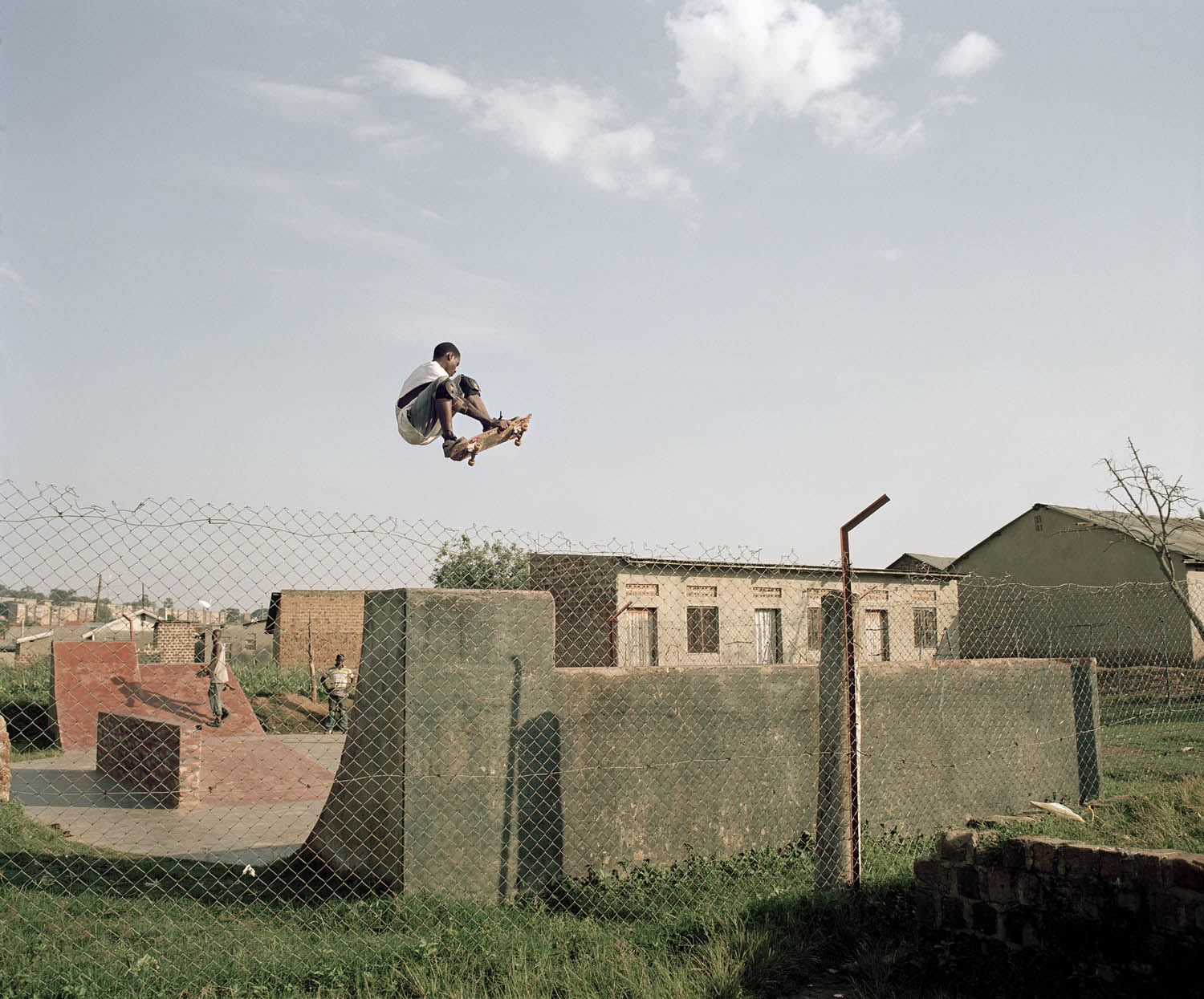 Douglas, 20, sets a great example for all the skaters and wants to take the Ugandan skateboarding scene to a higher level. Though he spends most of his time on the board, he finds time to clean the park and teach the younger children. 