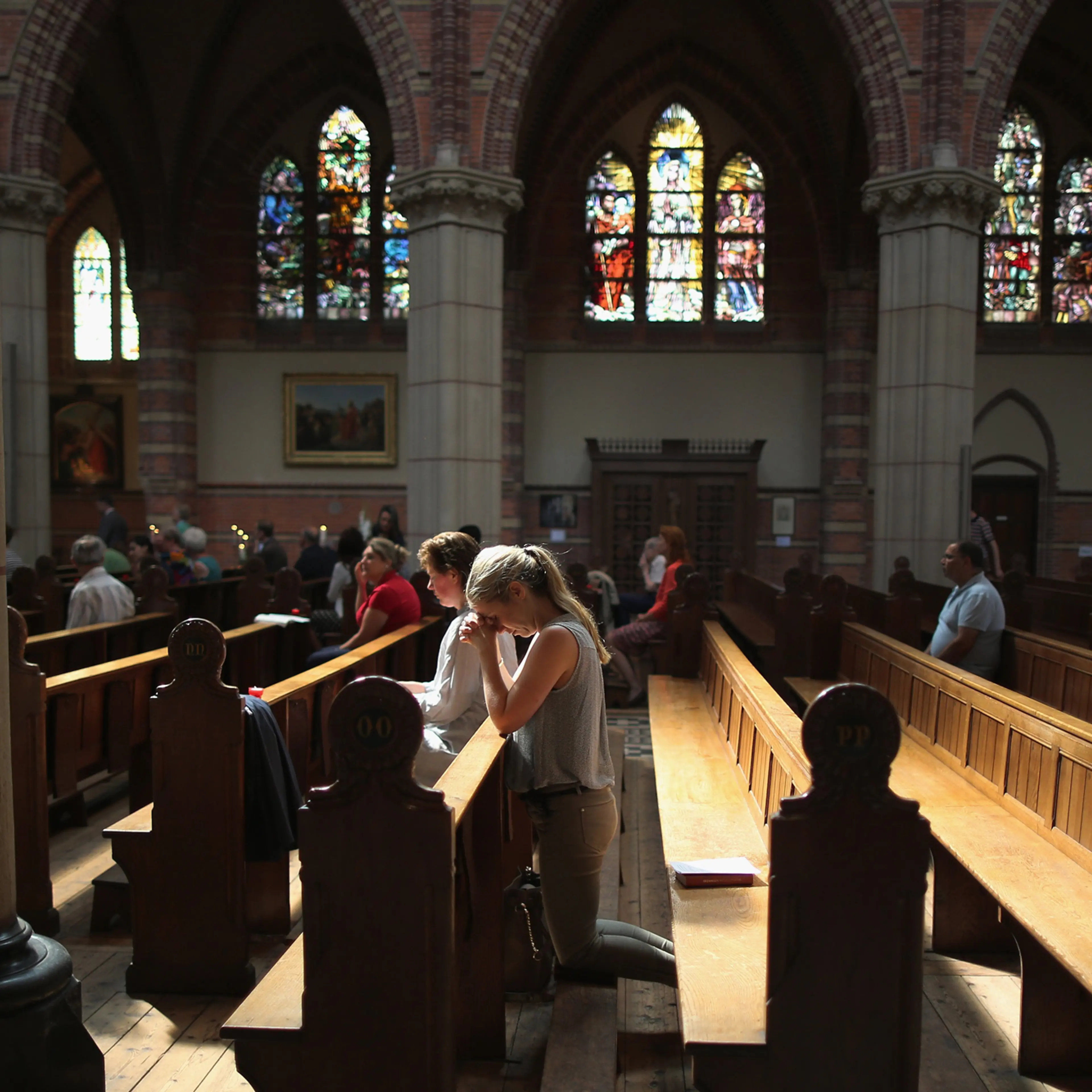 Local people pray during a special mass in Saint Vitus Church in memory of the victims of Malaysia Airlines flight MH17 on July 20, 2014 in Hilversum, Netherlands.