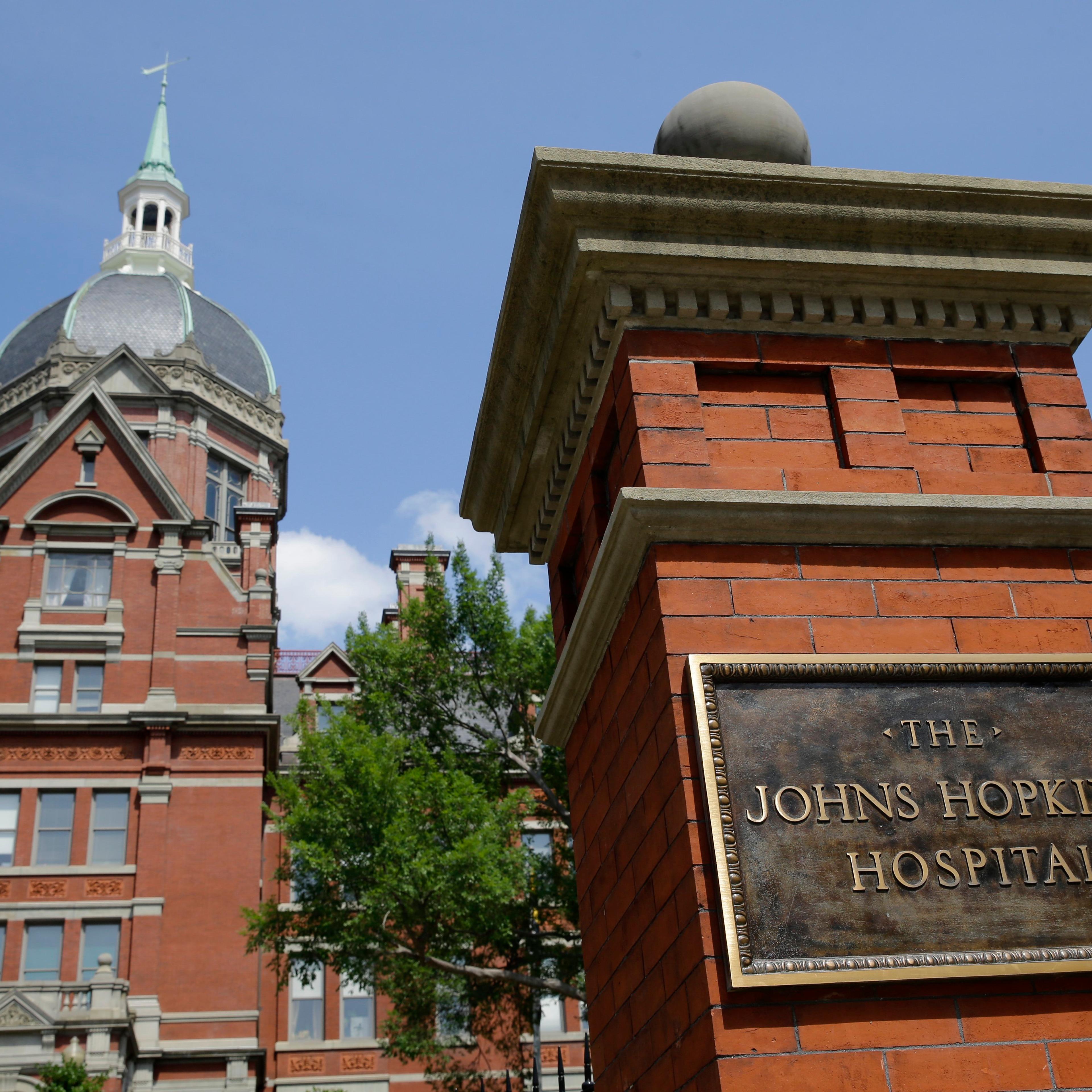 A sign stands in front of part of the Johns Hopkins Hospital complex on July 8, 2014, in Baltimore.