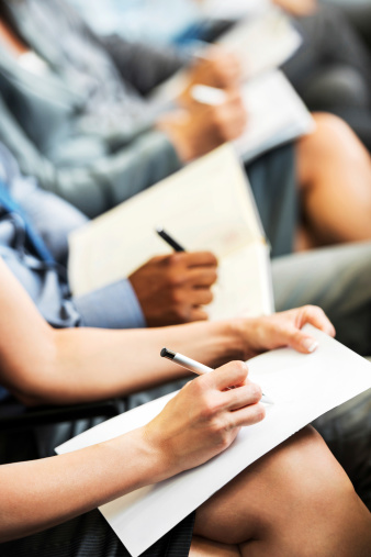 people-taking-notes-seminar