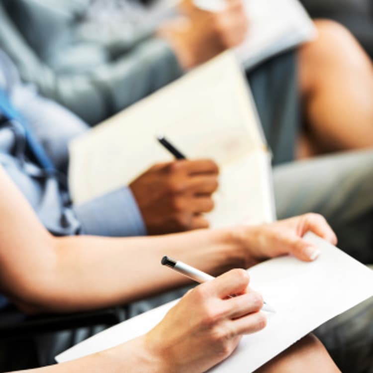 people-taking-notes-seminar