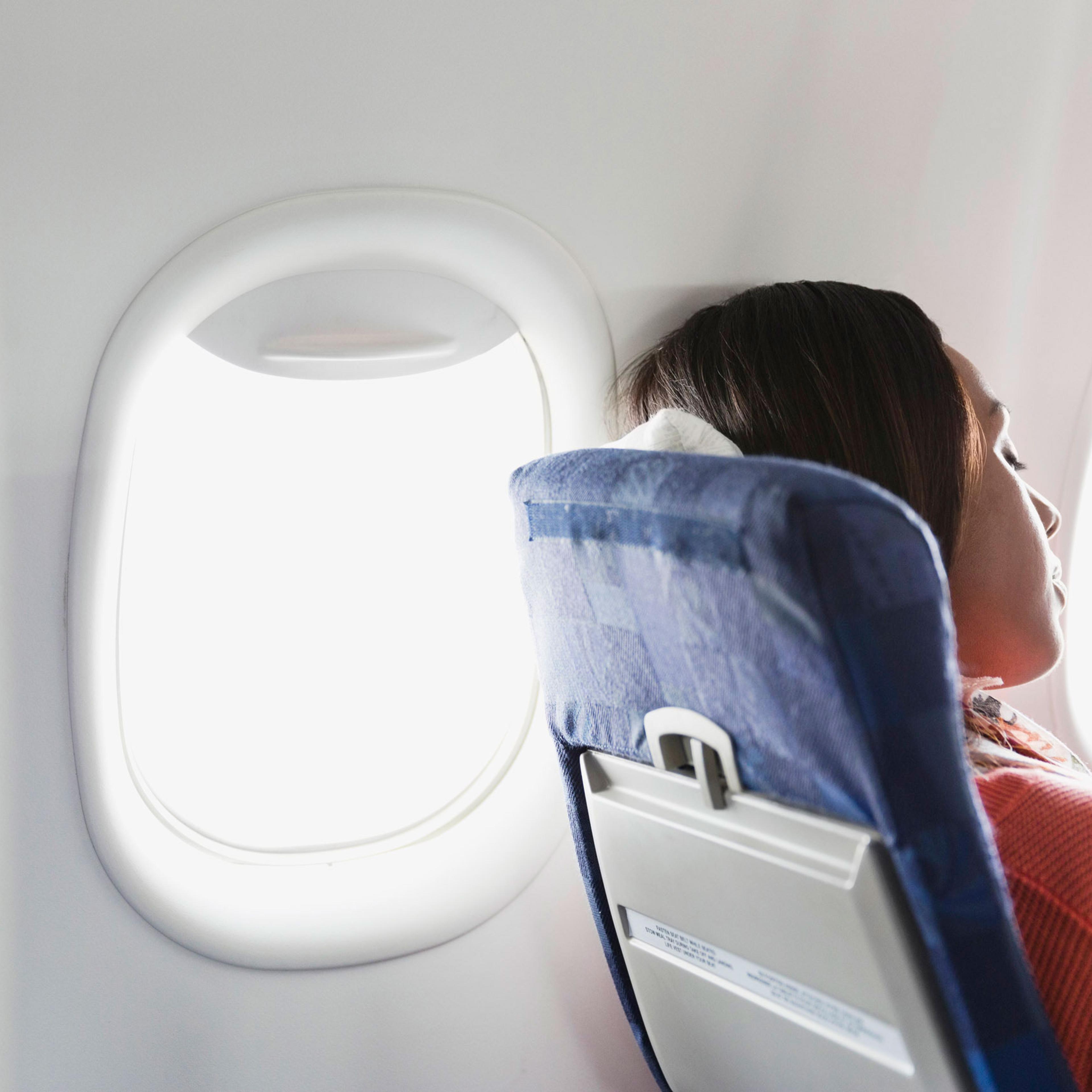 Woman sleeping in airplane