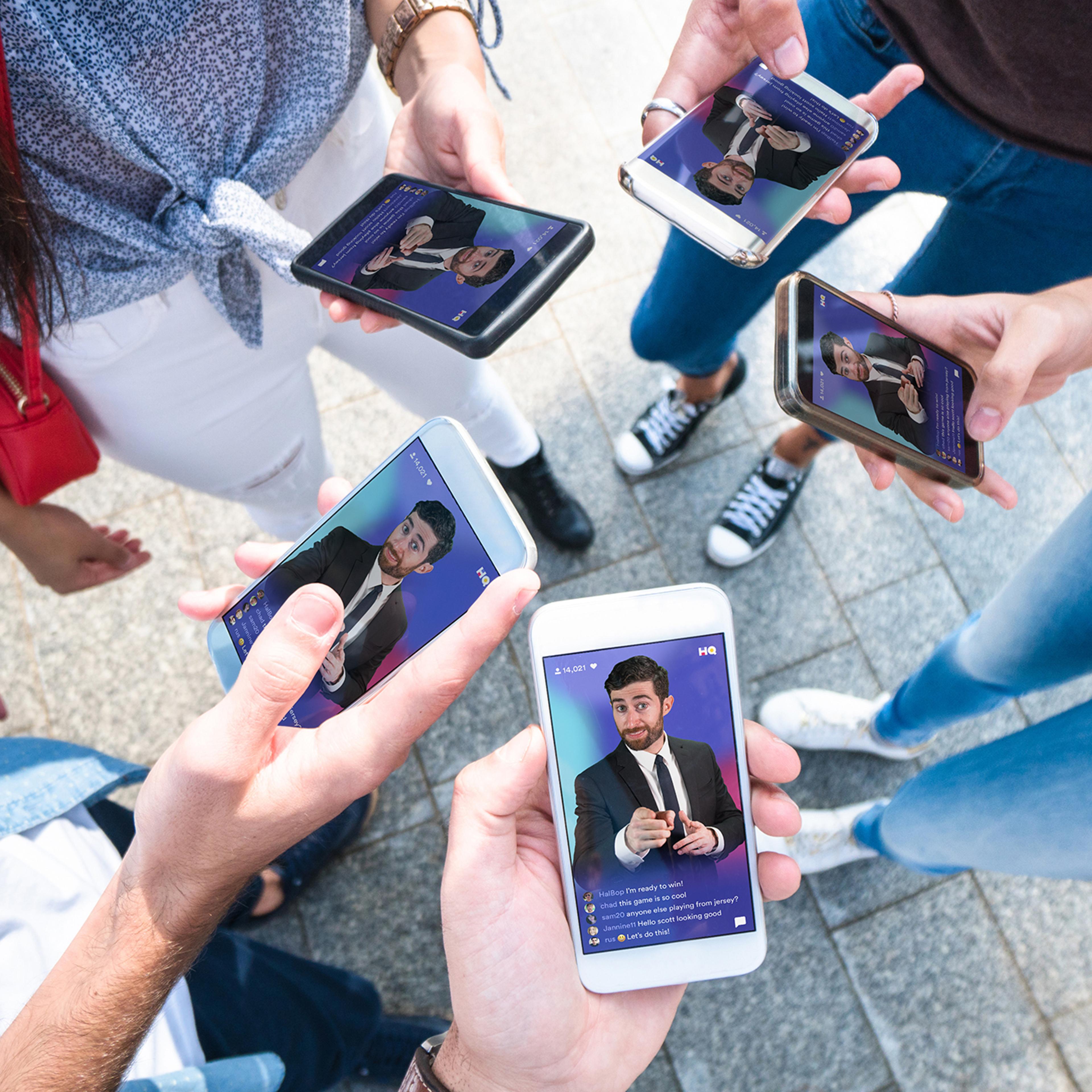 A group of friends playing HQ Trivia