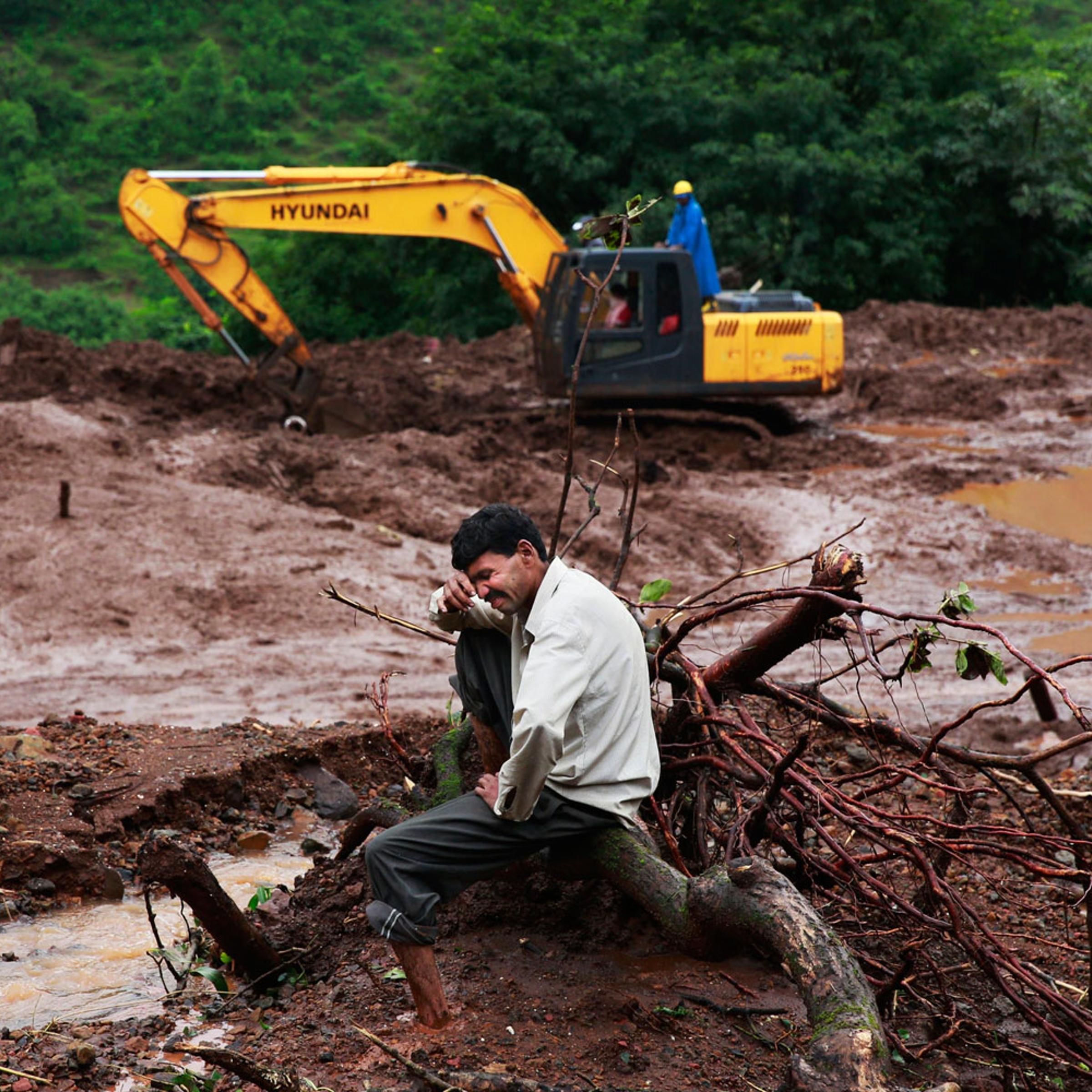 Chandrakant Zanjare, who said he lost 13 family members to a landslide, wails near the site where his house stood in Malin village, in the western Indian state of Maharashtra on Aug. 1, 2014.