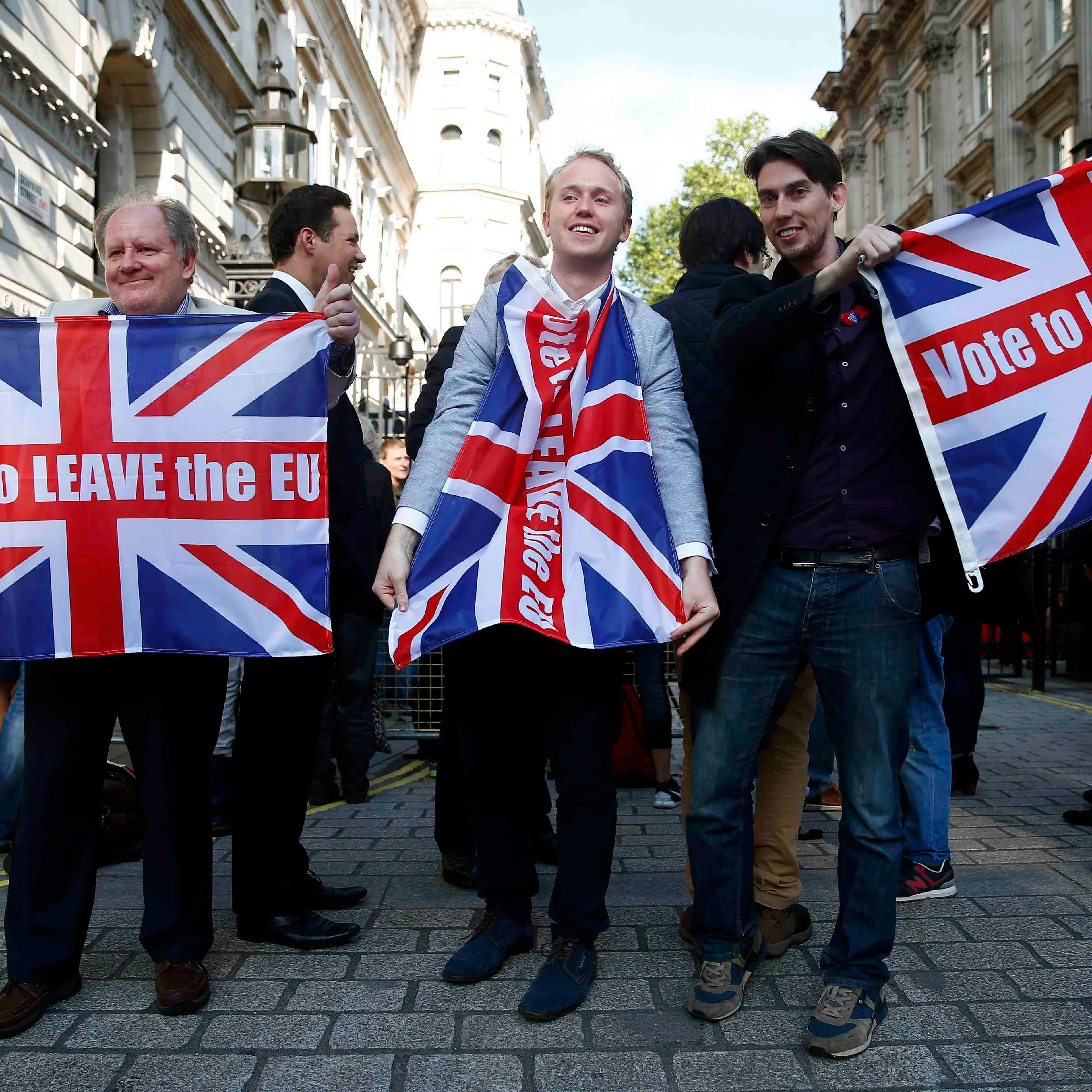 Vote leave supporters wave Union flags, following the result of the EU referendum, outside Downing Street in London on June 24, 2016.