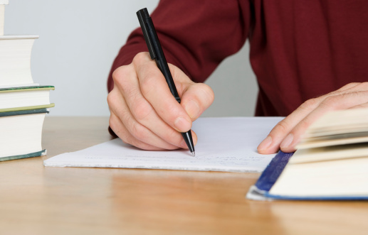 close-up-hand-taking-notes