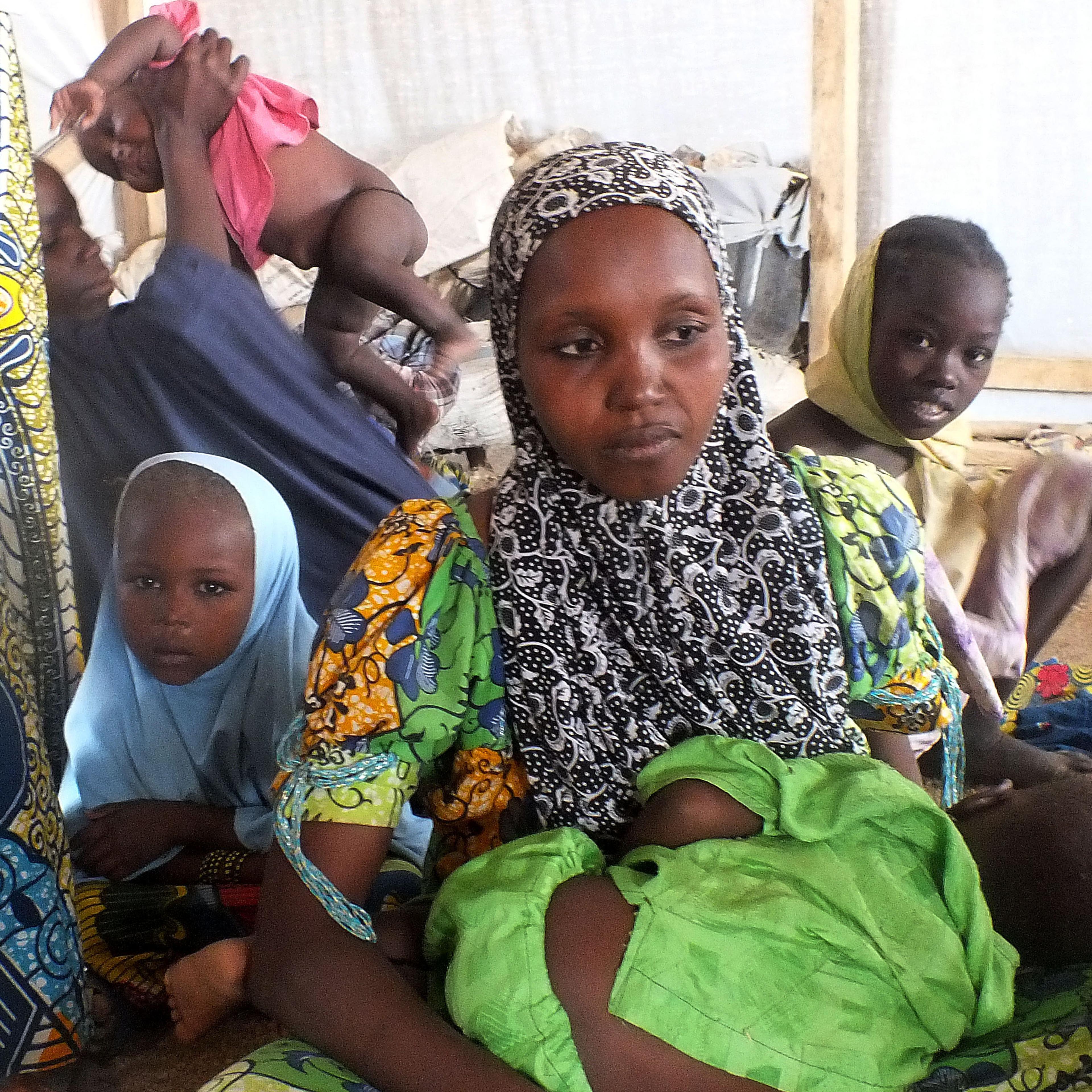 In this file photo taken on Feb. 25, 2015, a family of refugees that fled their homes due to violence from the militant group Boko Haram sit inside a refugee camp in Minawao, Cameroon