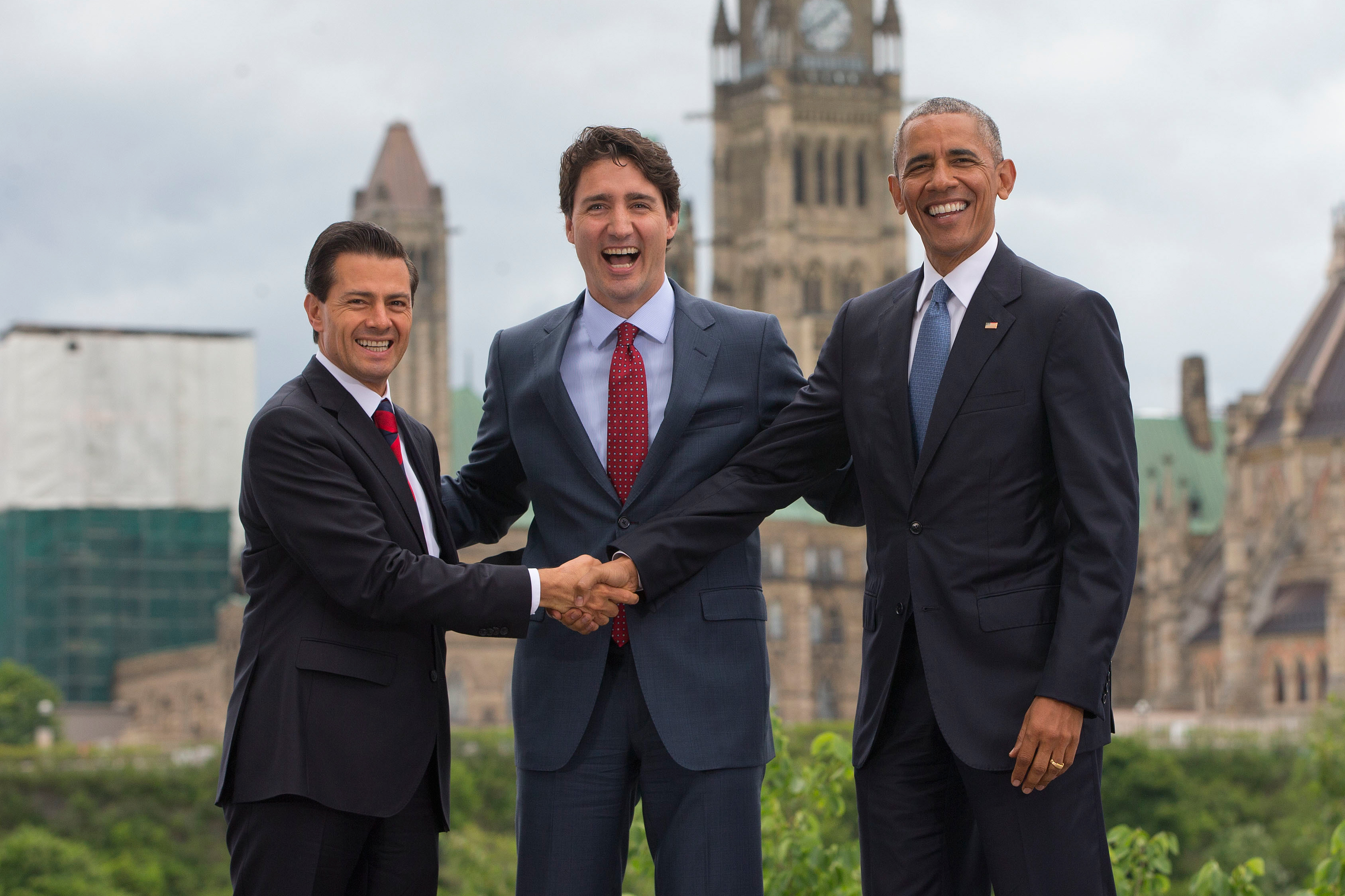 From left: Mexican President Enrique Pena Neito, Canadian Prime Minister Justin Trudeau and President Barack Obama, stand in front of Parliament Hill during the North America Leaders' Summit at the National Gallery of Canada on June 29, 2016 in Ottawa, C