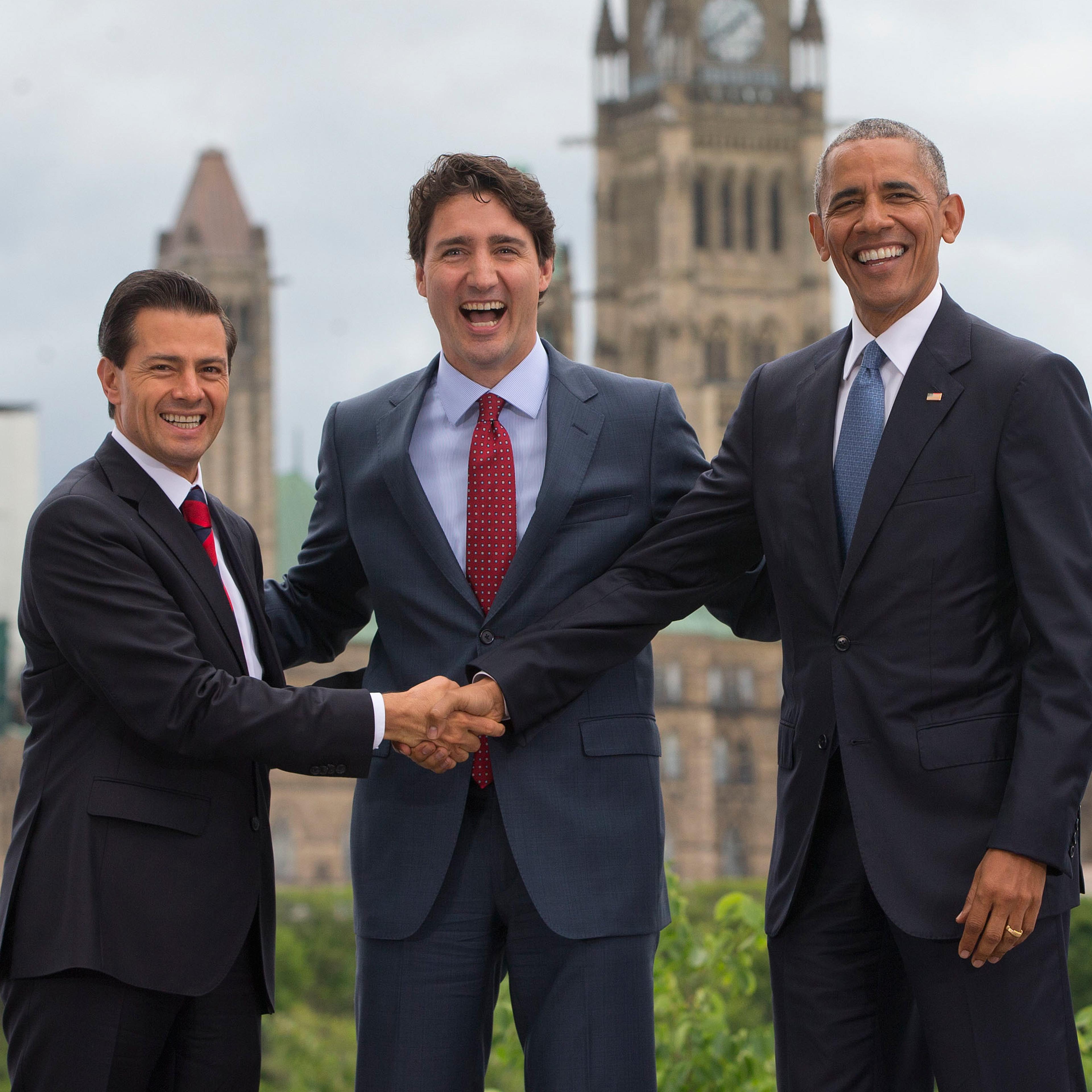 From left: Mexican President Enrique Pena Neito, Canadian Prime Minister Justin Trudeau and President Barack Obama, stand in front of Parliament Hill during the North America Leaders' Summit at the National Gallery of Canada on June 29, 2016 in Ottawa, C