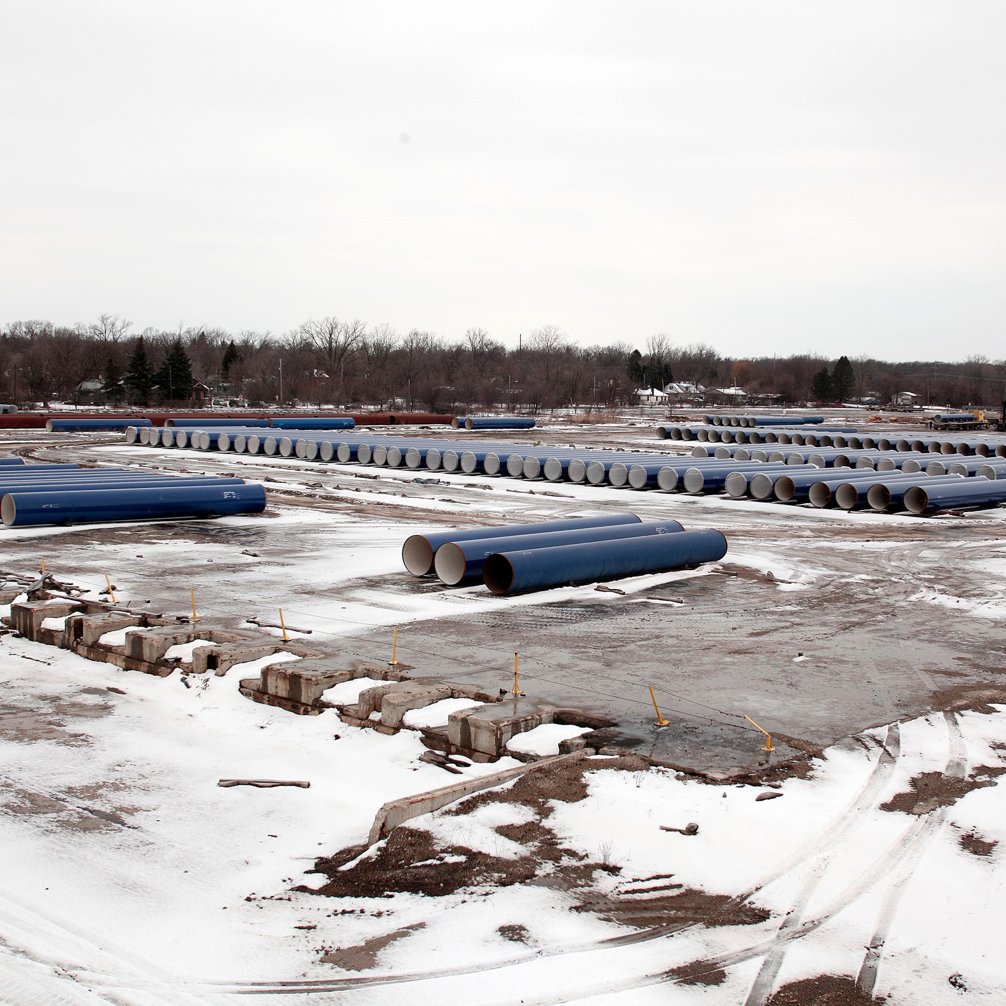 New water pipes awaiting installation are shown along the route of a national mile-long march, which was held to highlight the push for clean water in Flint, Mich., on Feb. 19, 2016.