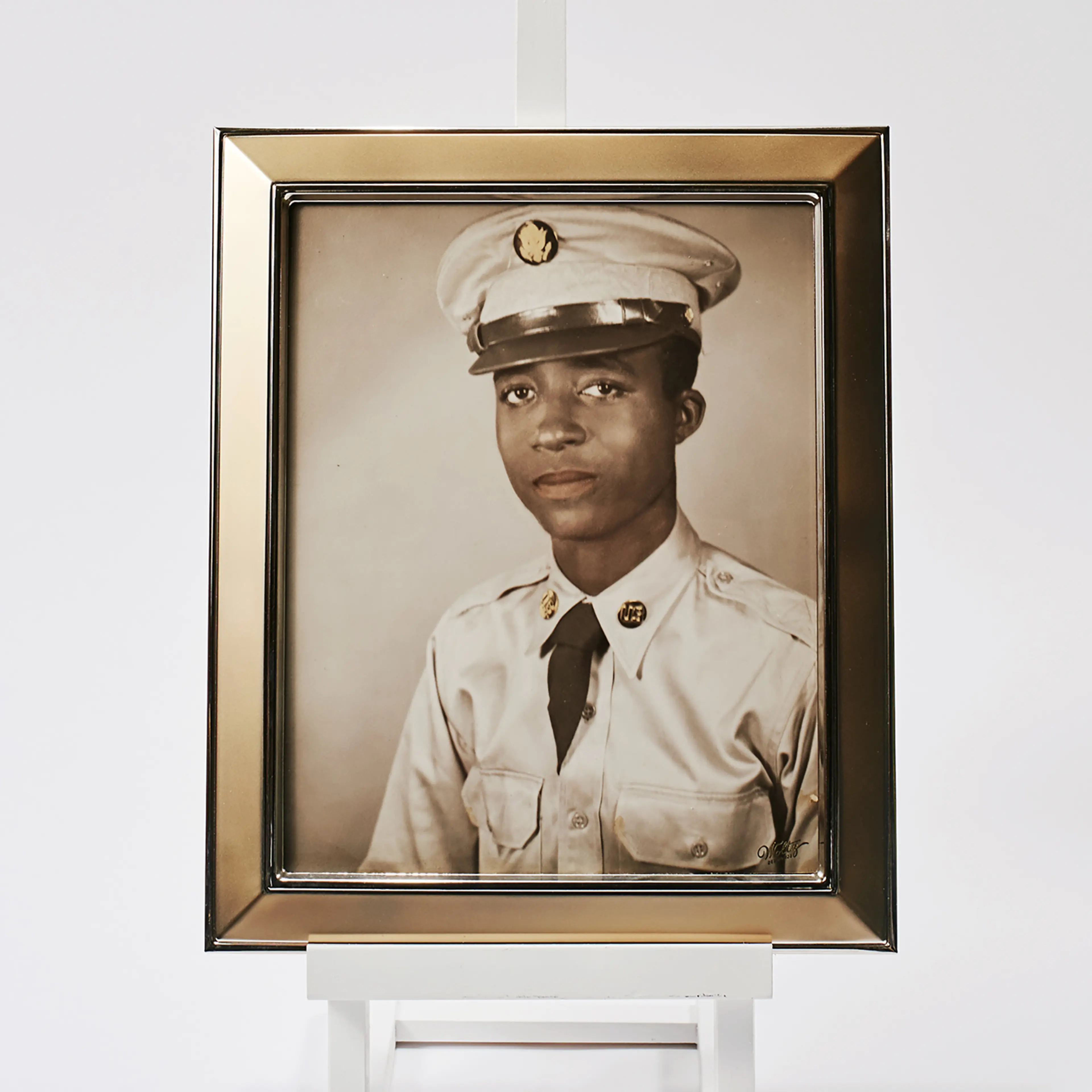 A framed portrait of Hoover, who left North Carolina for Korea in 1950.