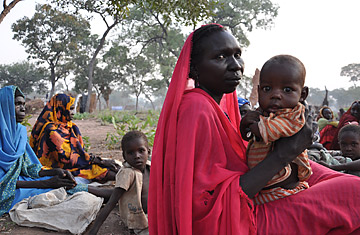 Women and children are among the refugees waiting for food aid to be distributed in Yida refugee camp in South Sudan, near the volatile border with Sudan, on Nov 16, 2011