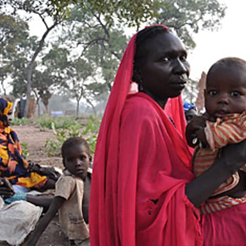 Women and children are among the refugees waiting for food aid to be distributed in Yida refugee camp in South Sudan, near the volatile border with Sudan, on Nov 16, 2011