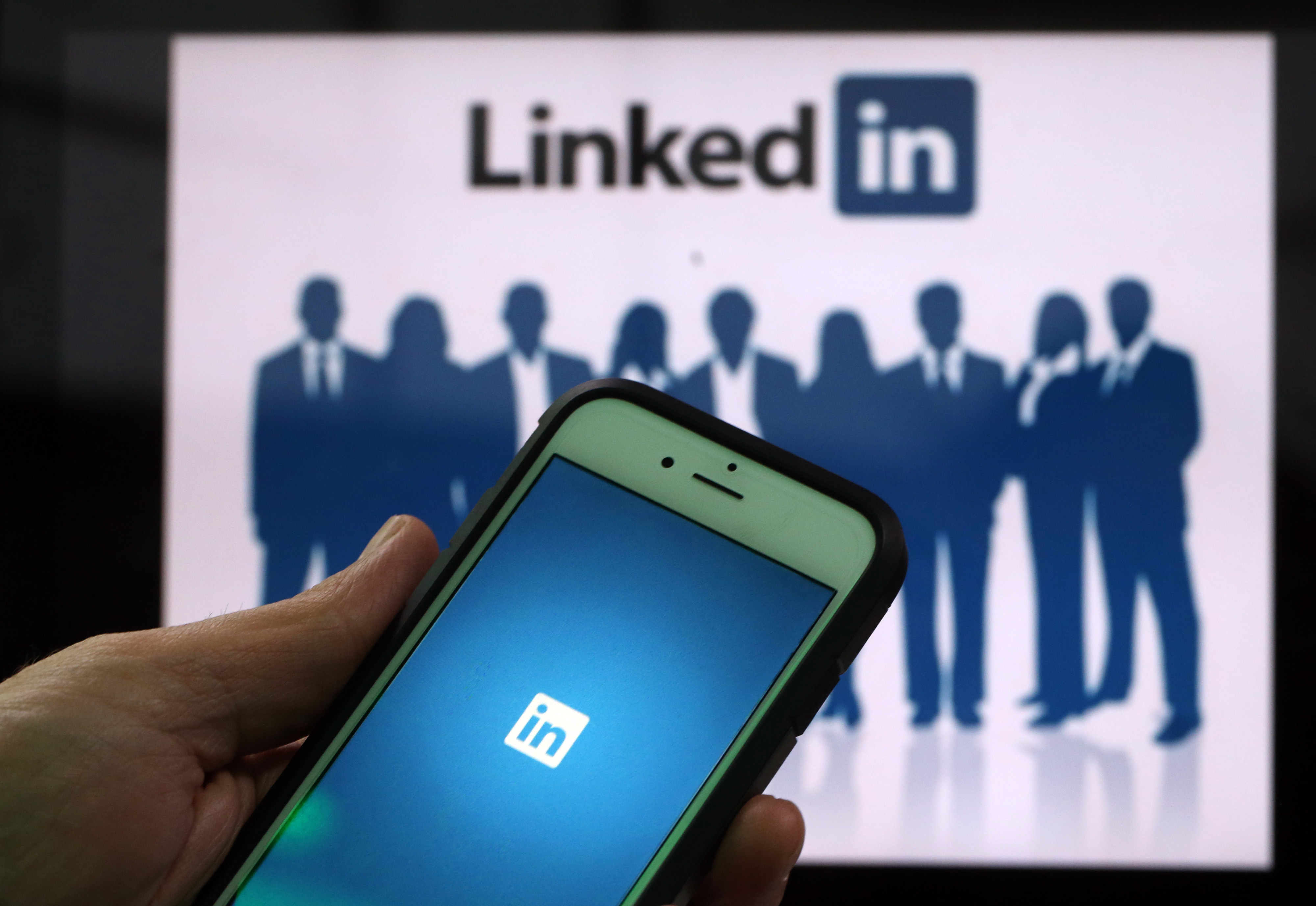 The LinkedIn Corp. logo is displayed on the screens of an Apple Inc. iPhone 6 and a laptop in this arranged photograph taken in London, U.K., on Friday, May, 15, 2015.