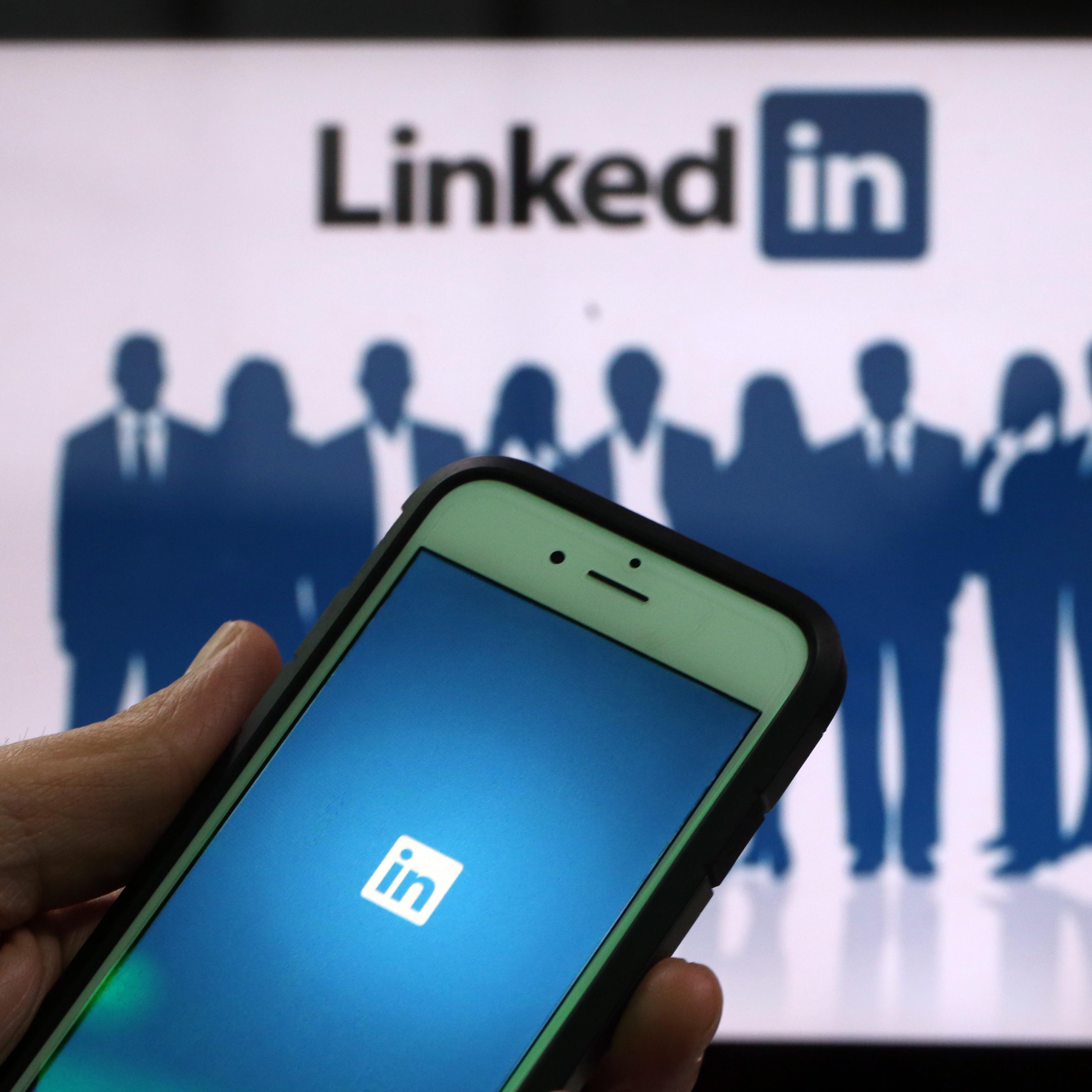 The LinkedIn Corp. logo is displayed on the screens of an Apple Inc. iPhone 6 and a laptop in this arranged photograph taken in London, U.K., on Friday, May, 15, 2015.