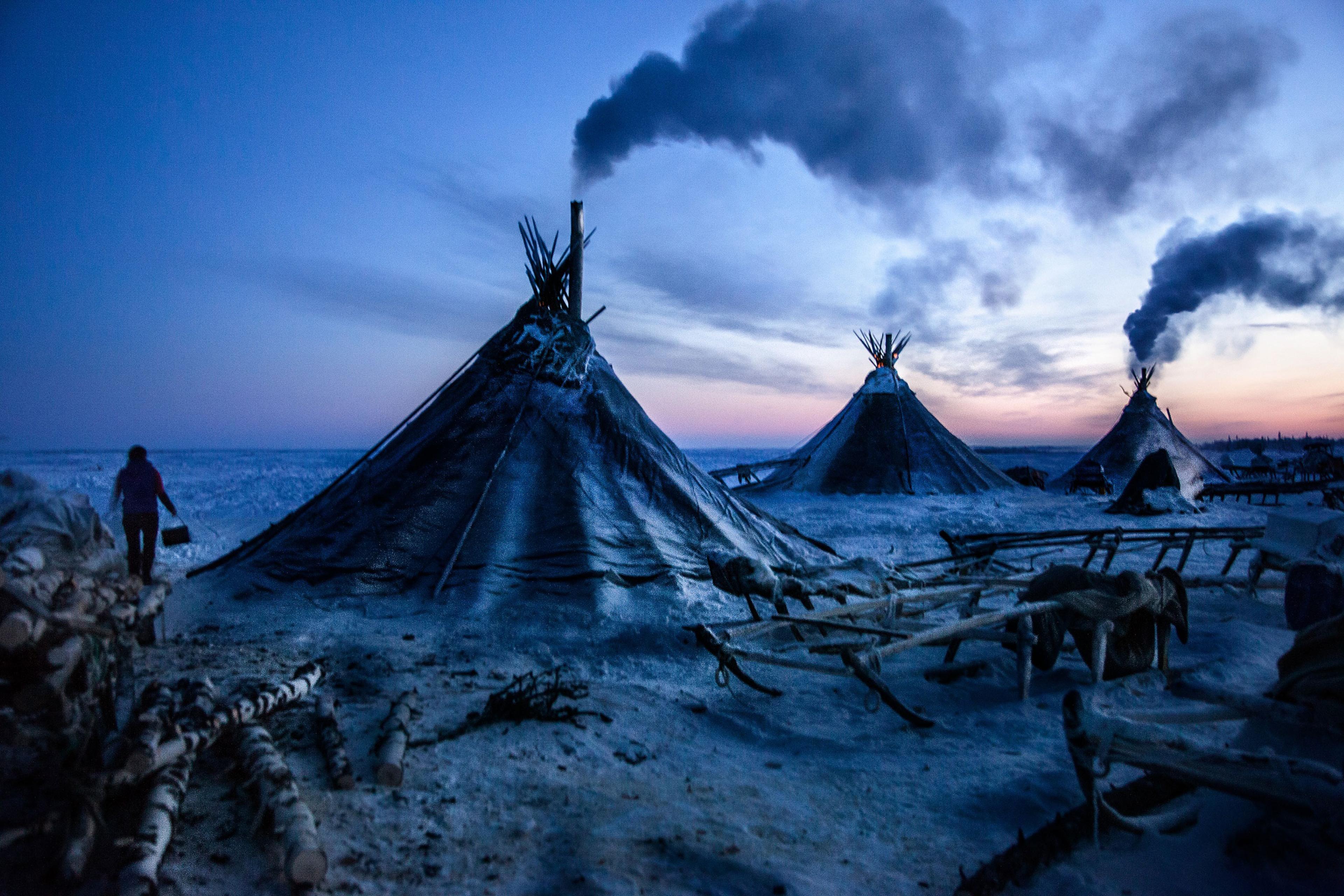 A colony of tents, or "chums", belonging to Nenets herders stand in the Arctic tundra in the Russian Nenets Autonomous Region. The indigenous people of the Russian Arctic, their culture eroded under Soviet collectivization and now their land is endanger