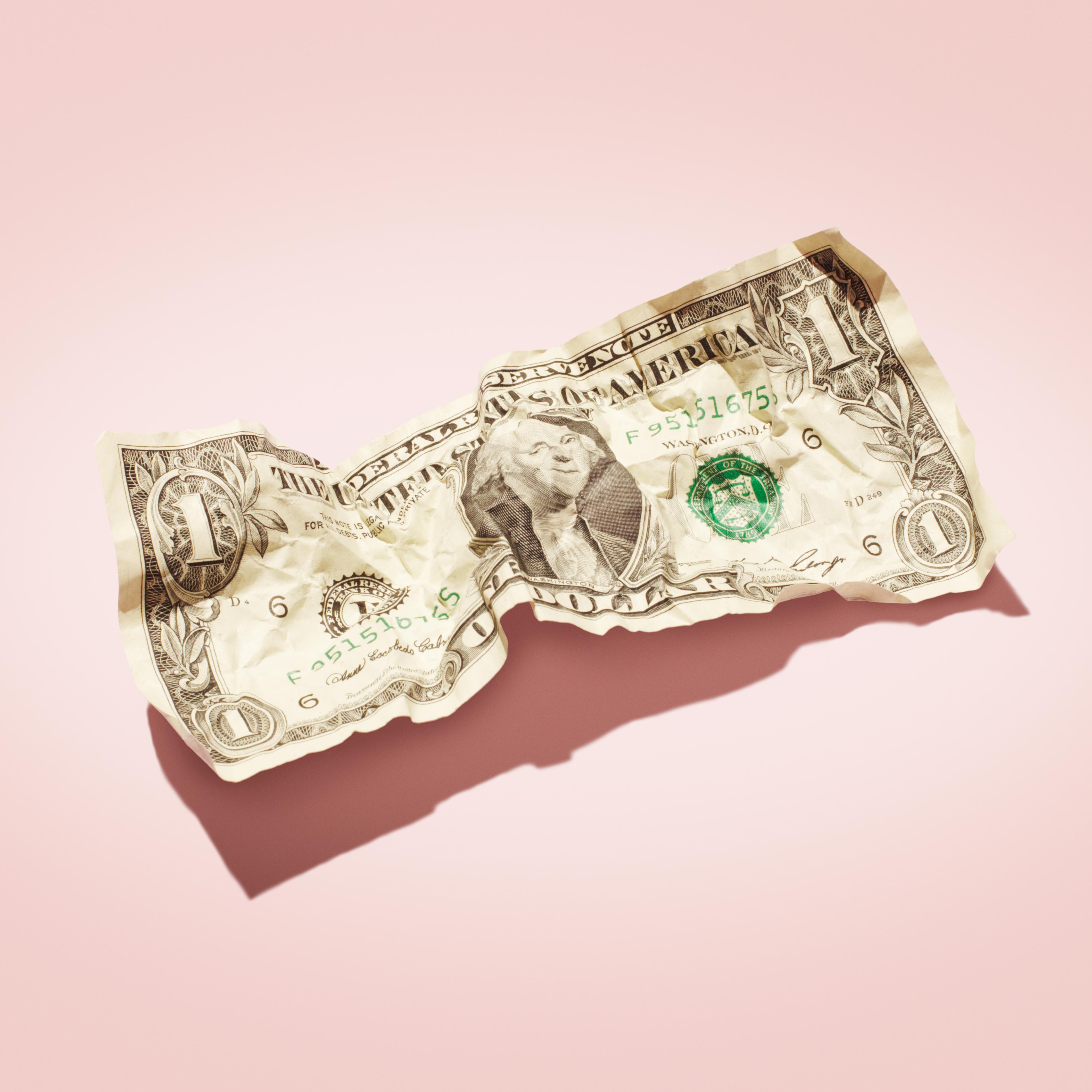 Crumpled 1 dollar note.