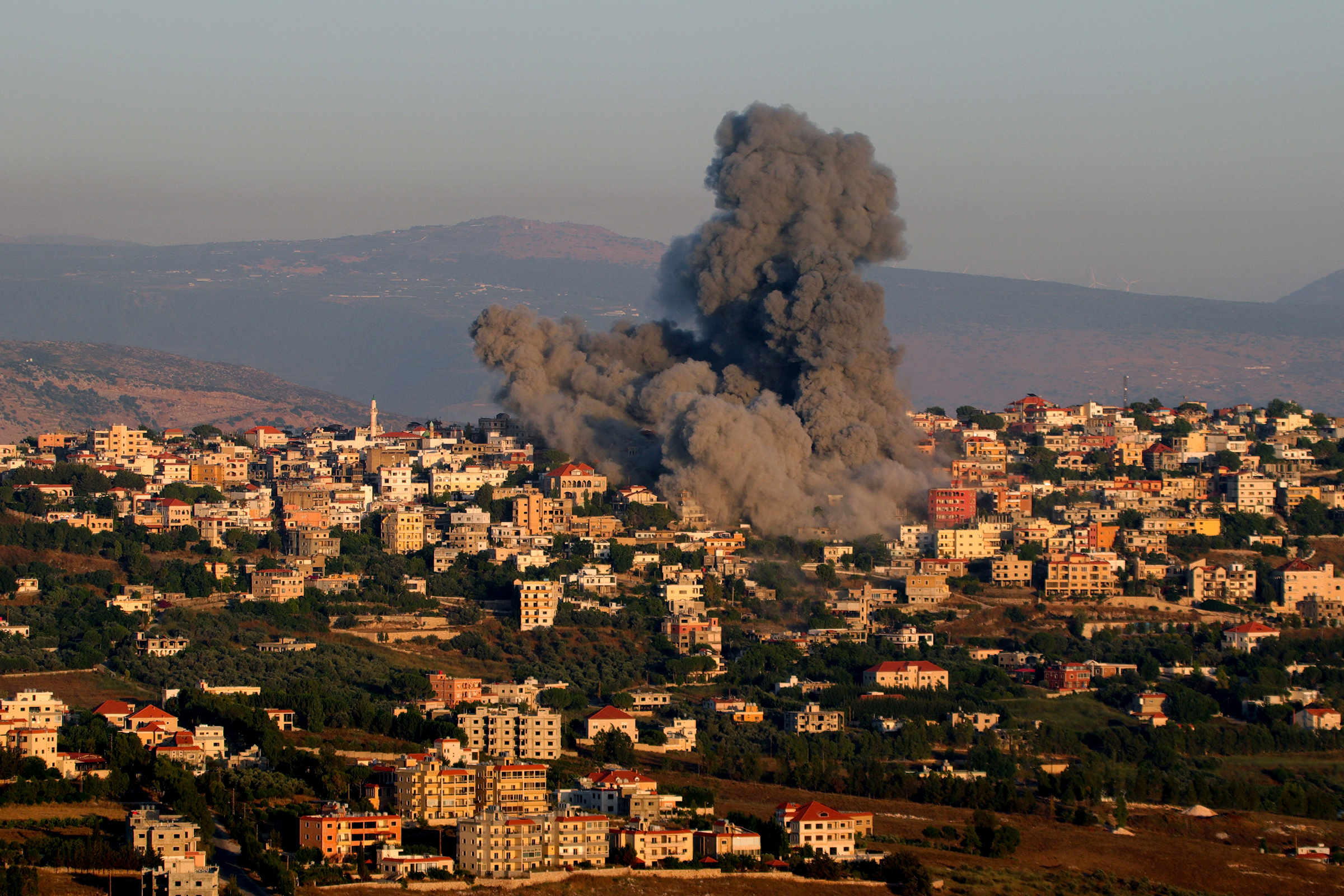Black smoke billows following an Israeli air strike that targeted a house in the southern Lebanese village of Khiam near the Lebanese-Israeli border on June 21, 2024, amid ongoing cross-border clashes between Israeli troops and Hezbollah fighters.