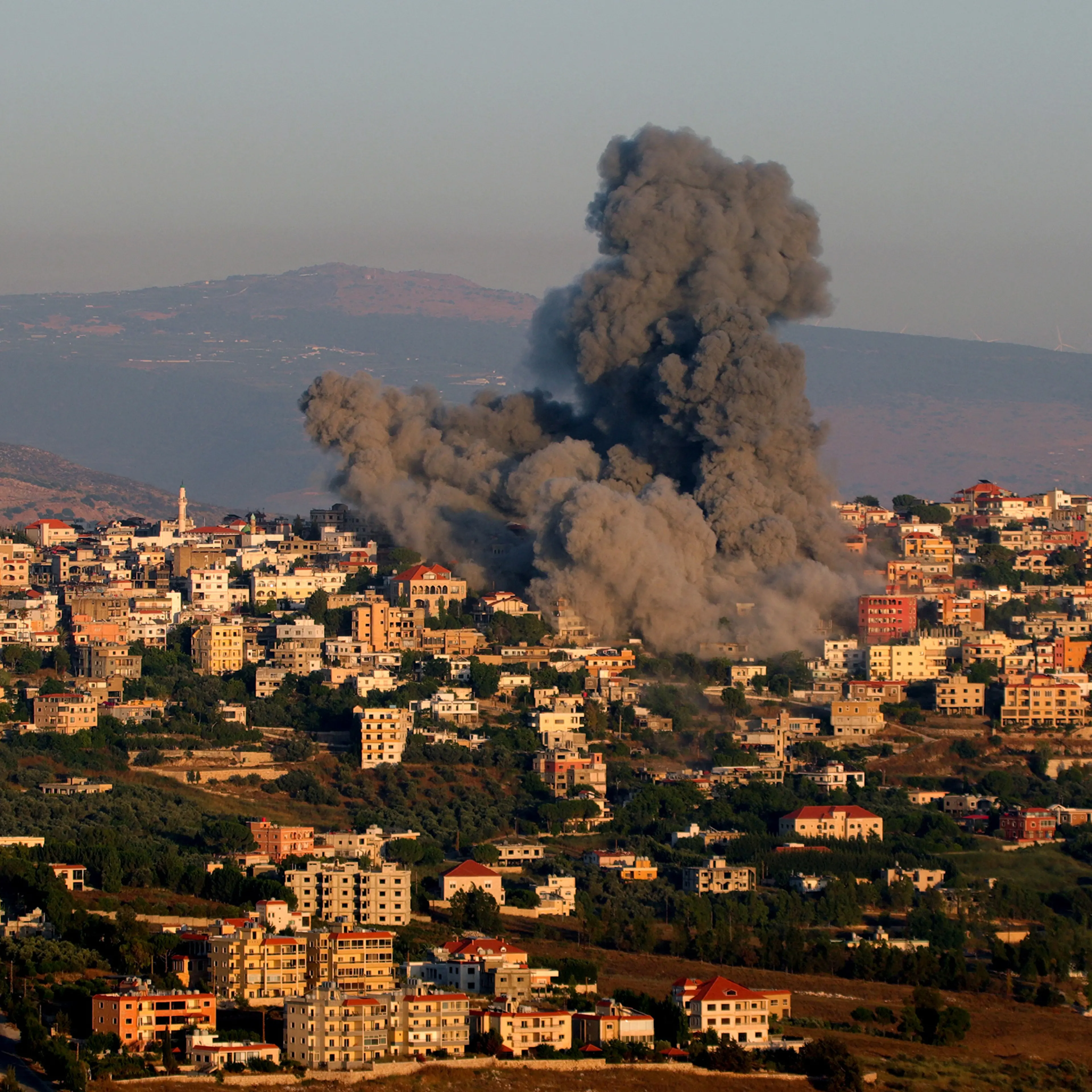 Black smoke billows following an Israeli air strike that targeted a house in the southern Lebanese village of Khiam near the Lebanese-Israeli border on June 21, 2024, amid ongoing cross-border clashes between Israeli troops and Hezbollah fighters.