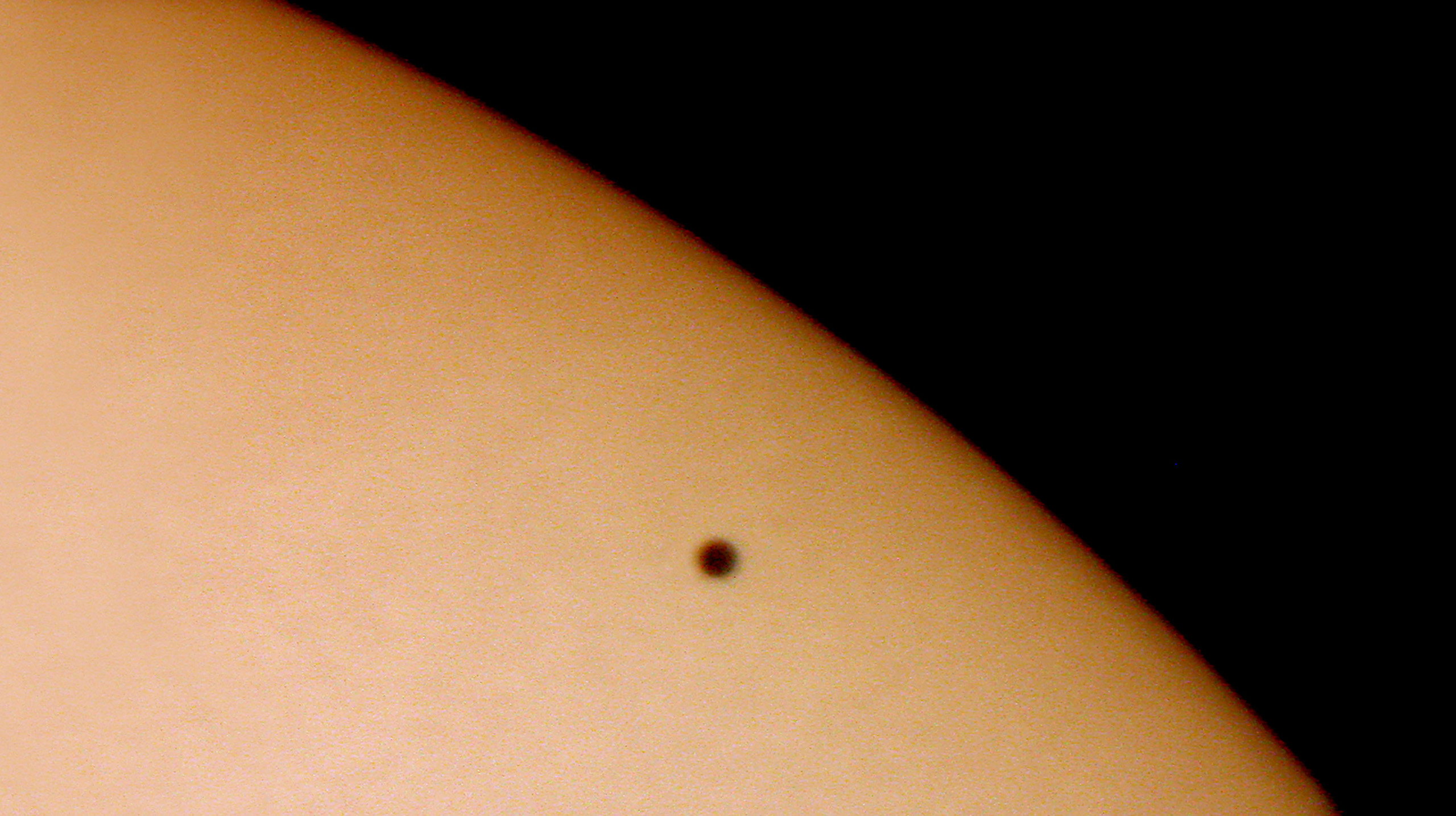 Planet Mercury transiting across the face of the Sun was taken on May 7, 2003.
