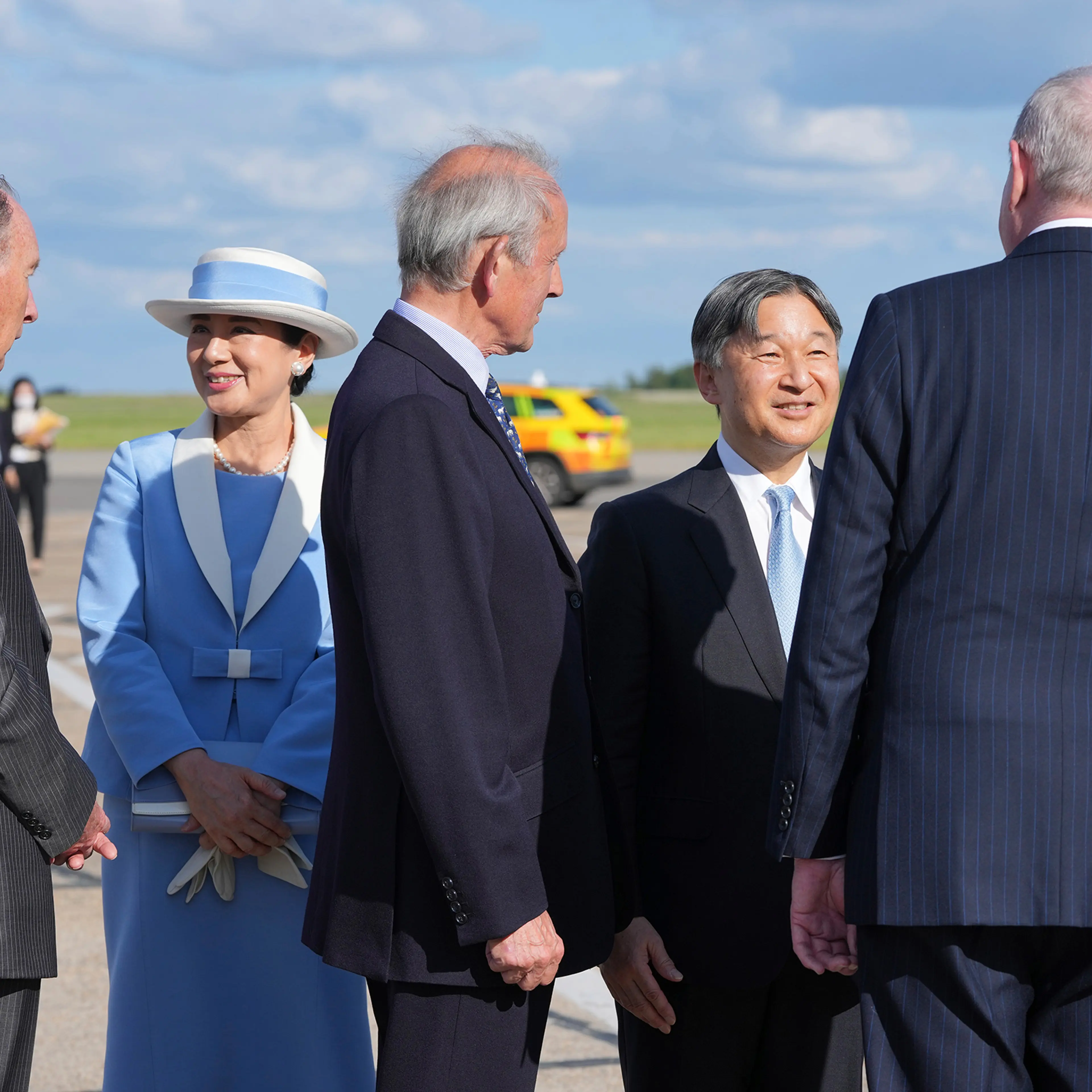 Emperor Naruhito and Empress Masako are greeted by dignitaries as they arrive at Stansted Airport, England, on June 22, 2024.