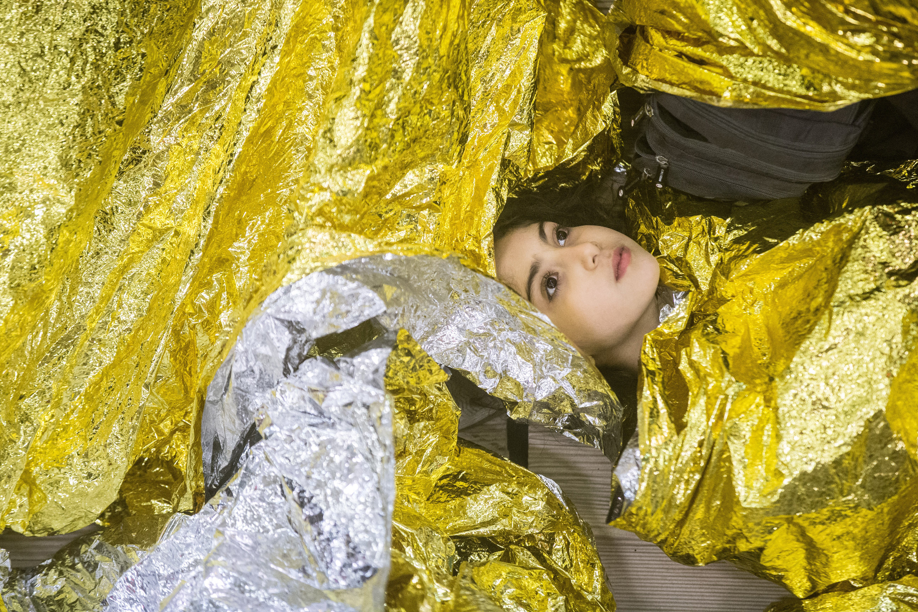 Syrian refugees sleeping on an Italian navy ship after being rescued from a fishing vessel carrying 443 Syrian asylum seekers, June 5.