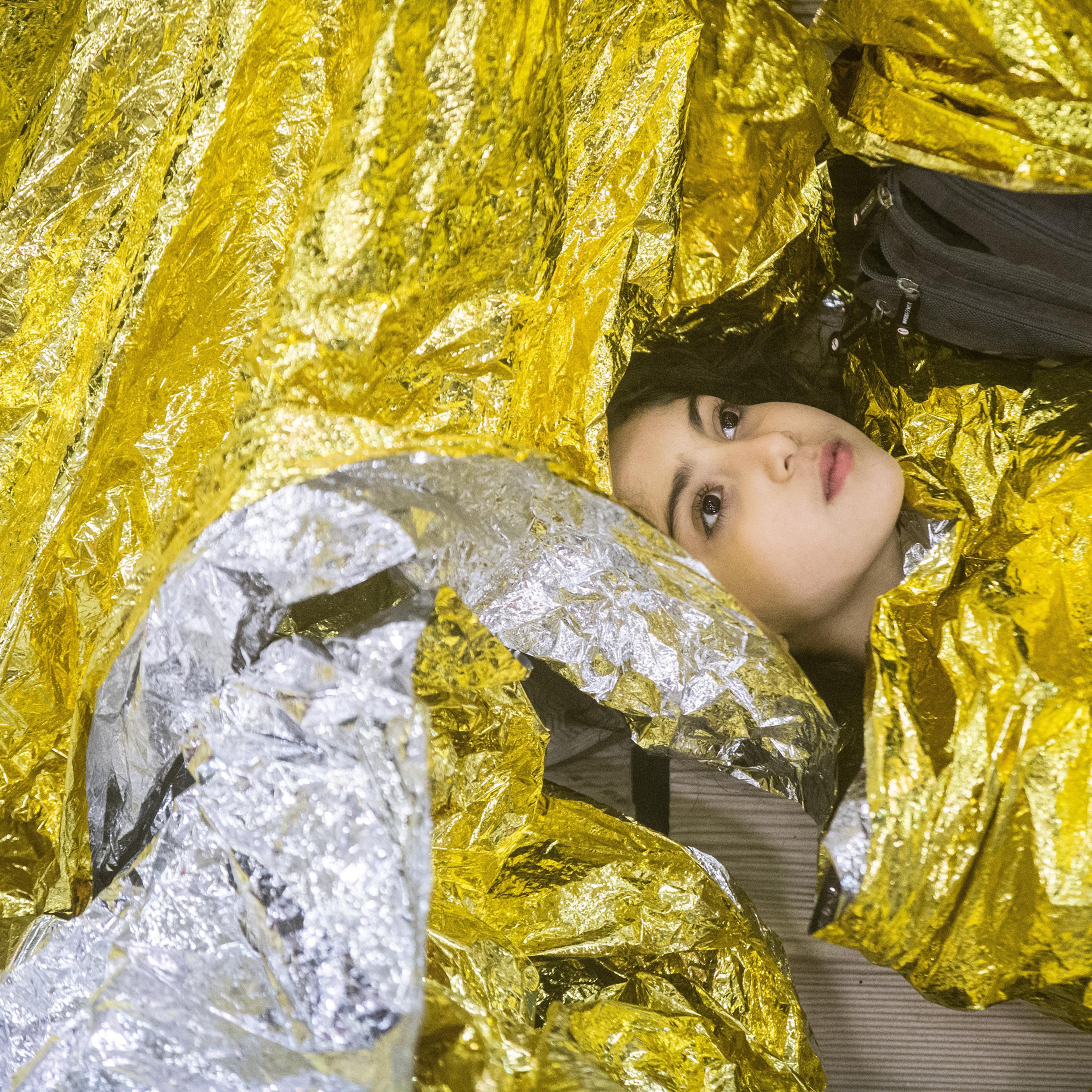 Syrian refugees sleeping on an Italian navy ship after being rescued from a fishing vessel carrying 443 Syrian asylum seekers, June 5.