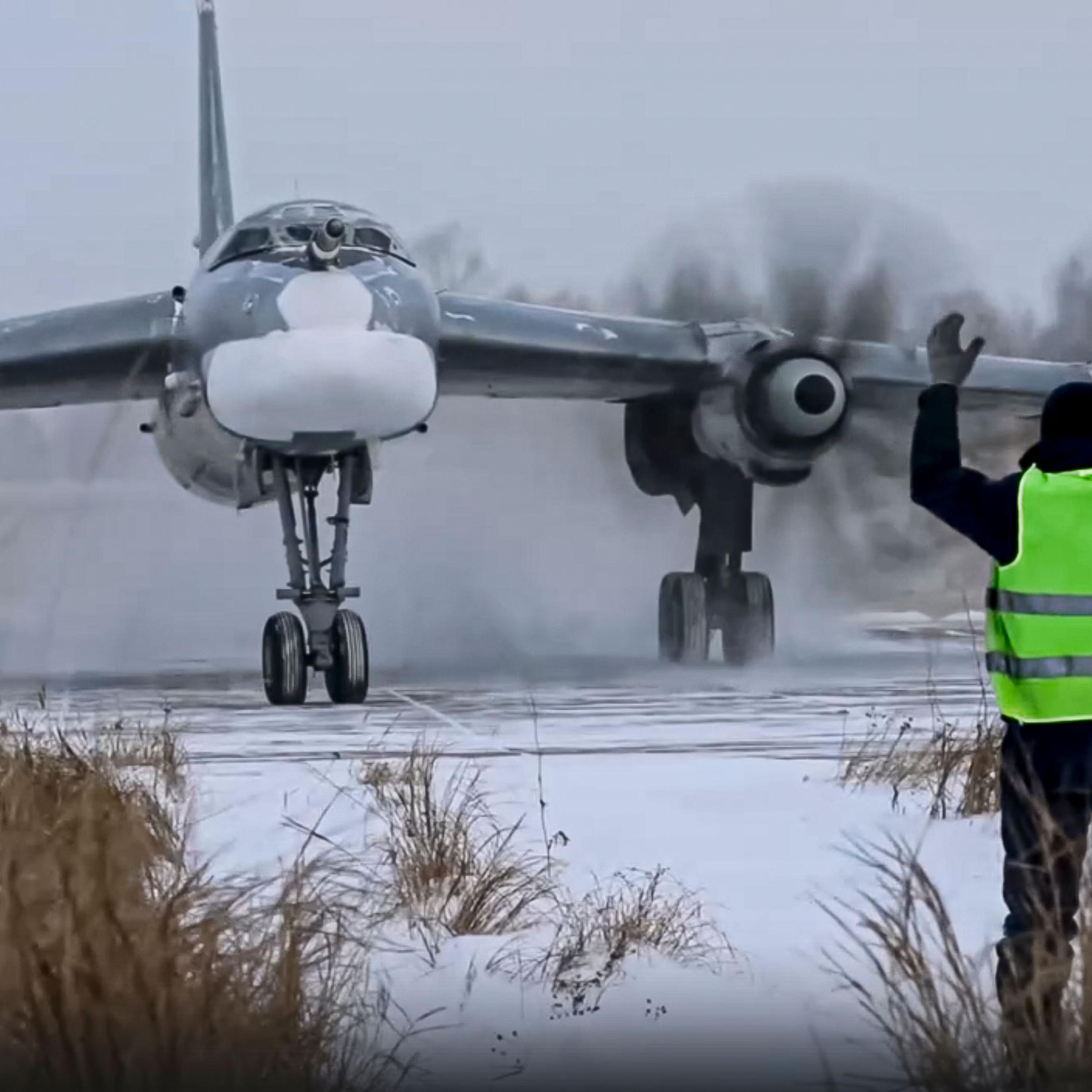 a Tu-95 strategic bomber of the Russian air force taxis before takeoff for a joint air patrol with Chinese bombers at an airbase in an unspecified location in Russia.