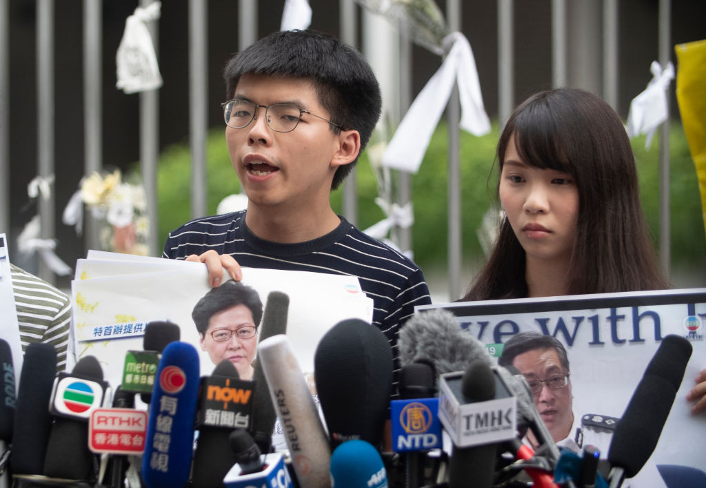 Pro-democracy party activists Joshua Wong and Agnes Chow
