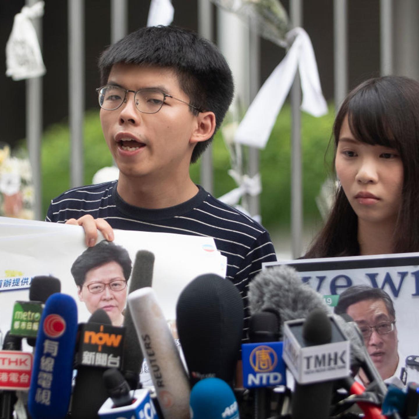 Pro-democracy party activists Joshua Wong and Agnes Chow