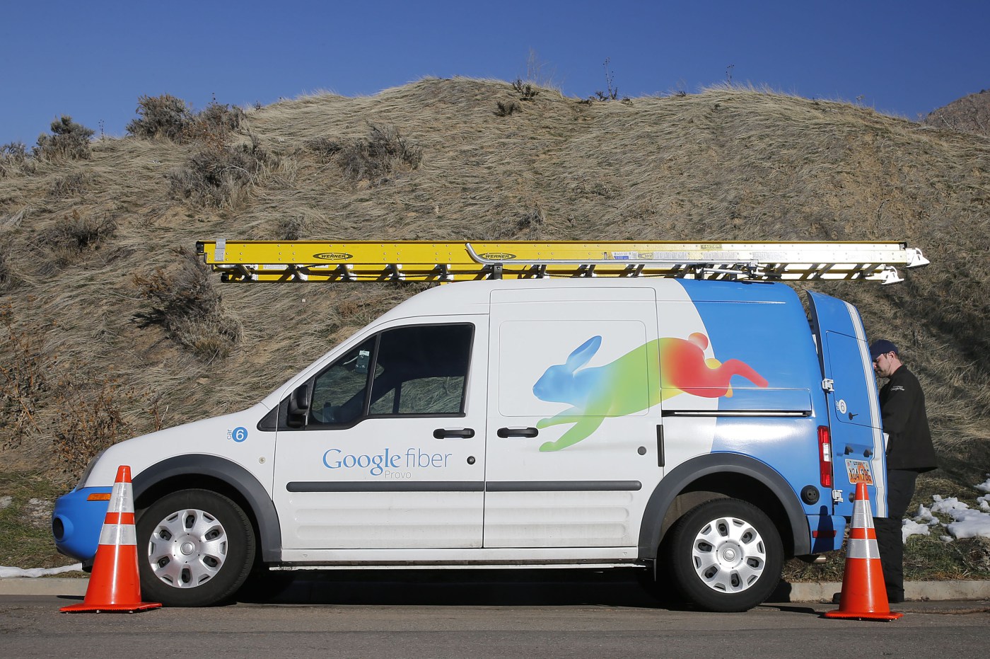 A Google Fiber technician gets supplies out of his truck to install Google Fiber in a residential home in Provo, Utah, January 2, 2014. Provo is one of three cities Google is currently building gigabit internet and television service for business and res