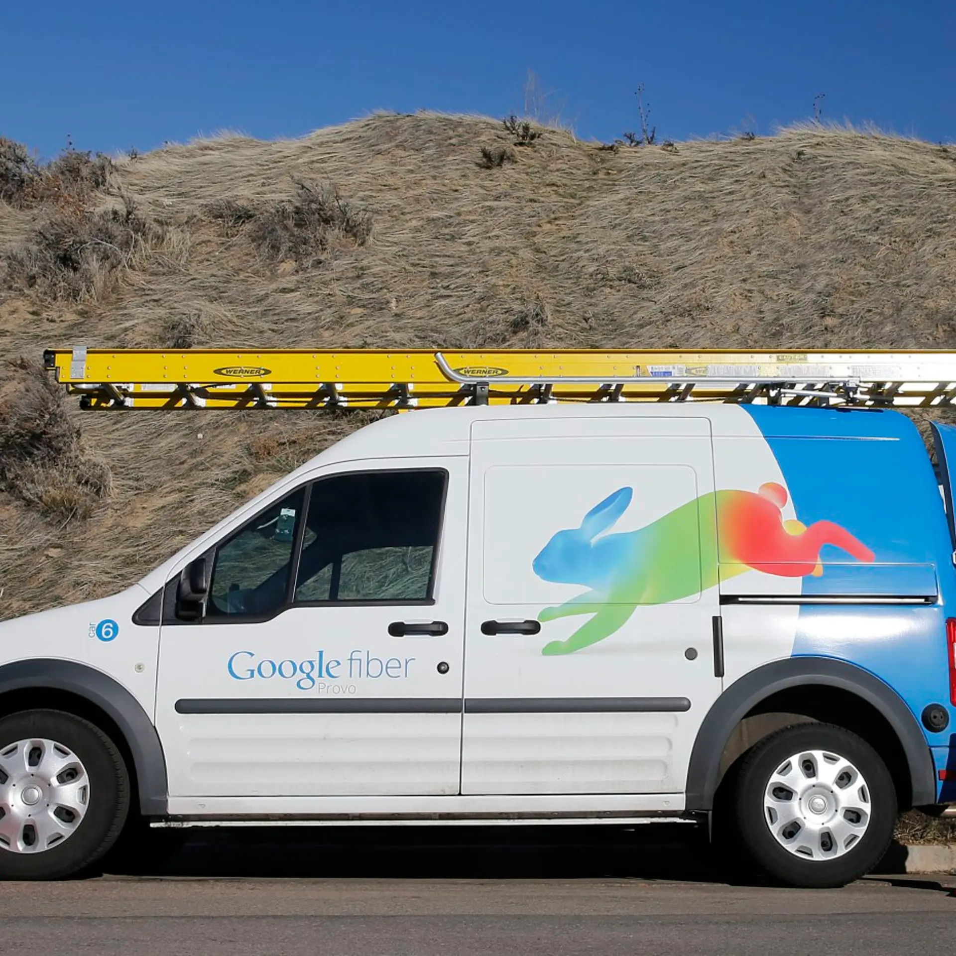 A Google Fiber technician gets supplies out of his truck to install Google Fiber in a residential home in Provo, Utah, January 2, 2014. Provo is one of three cities Google is currently building gigabit internet and television service for business and res