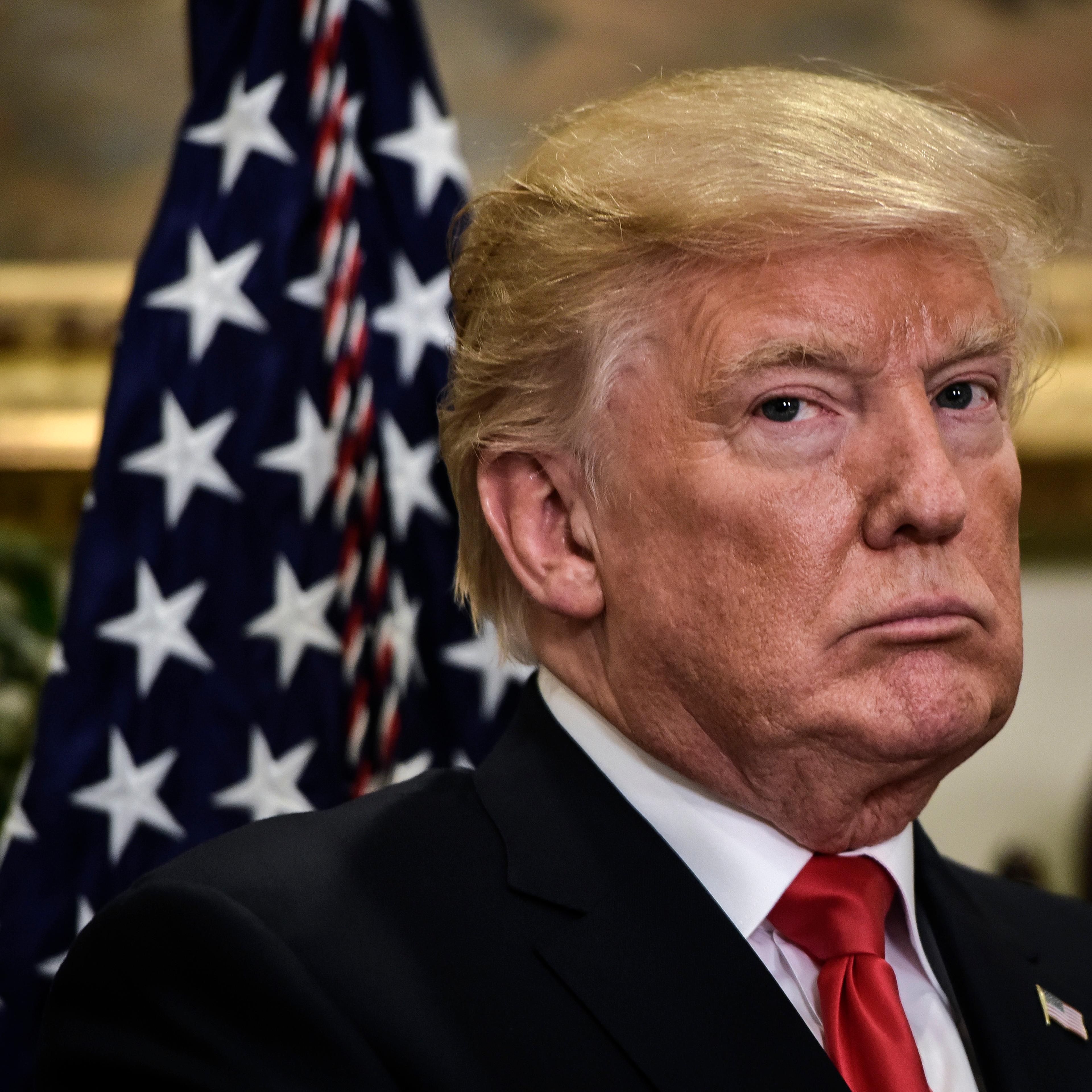 President Donald Trump presents a demonstration of a pharmaceutical glass packaging initiative, in Washington, DC.