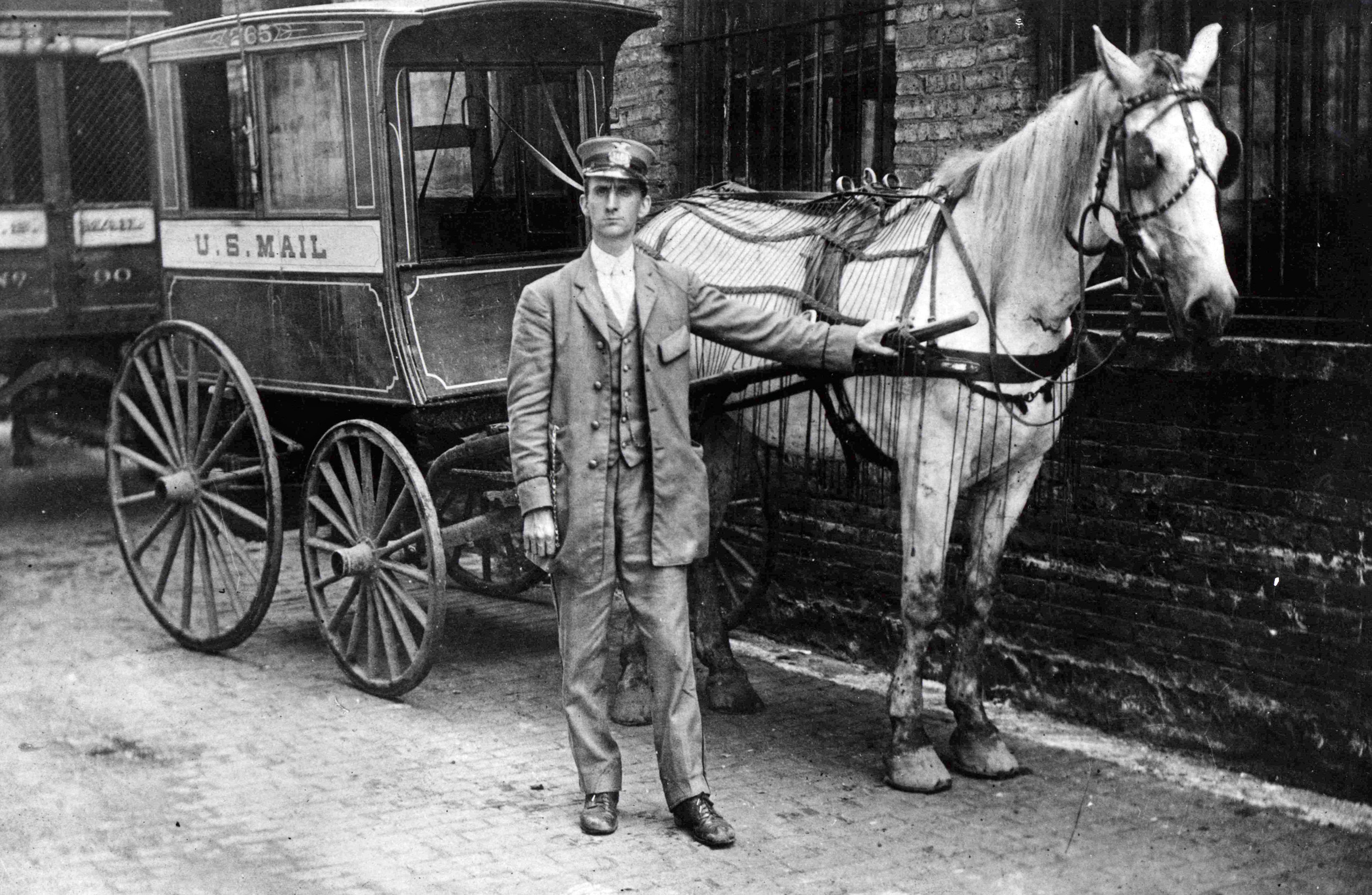 City collection mail wagon manufactured by Studebaker Brothers. The wagon was used to collect mail from sidewalk mailboxes in Chicago, Illinois. 1890.