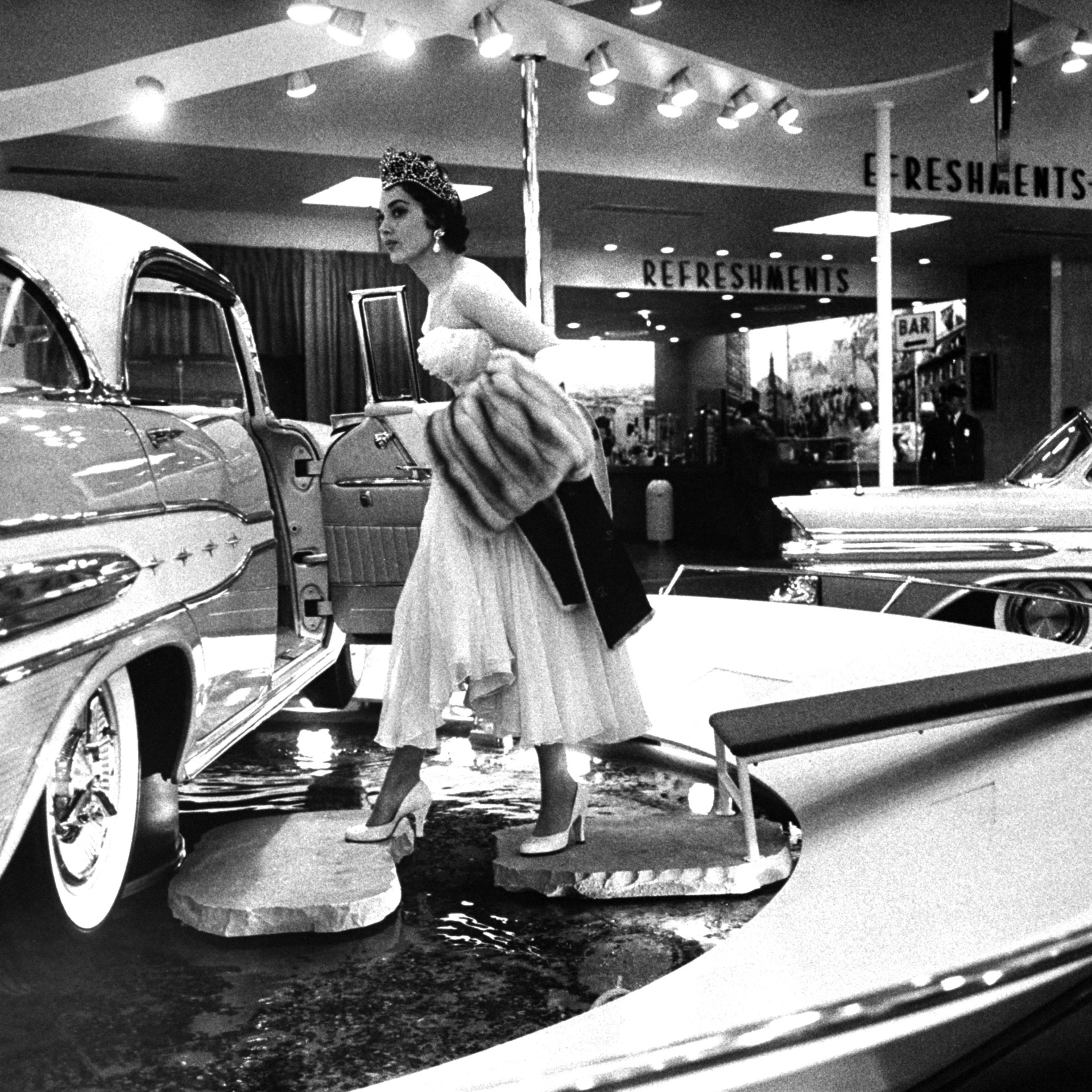National Automobile Show at the New York Coliseum featuring 1957 lines.