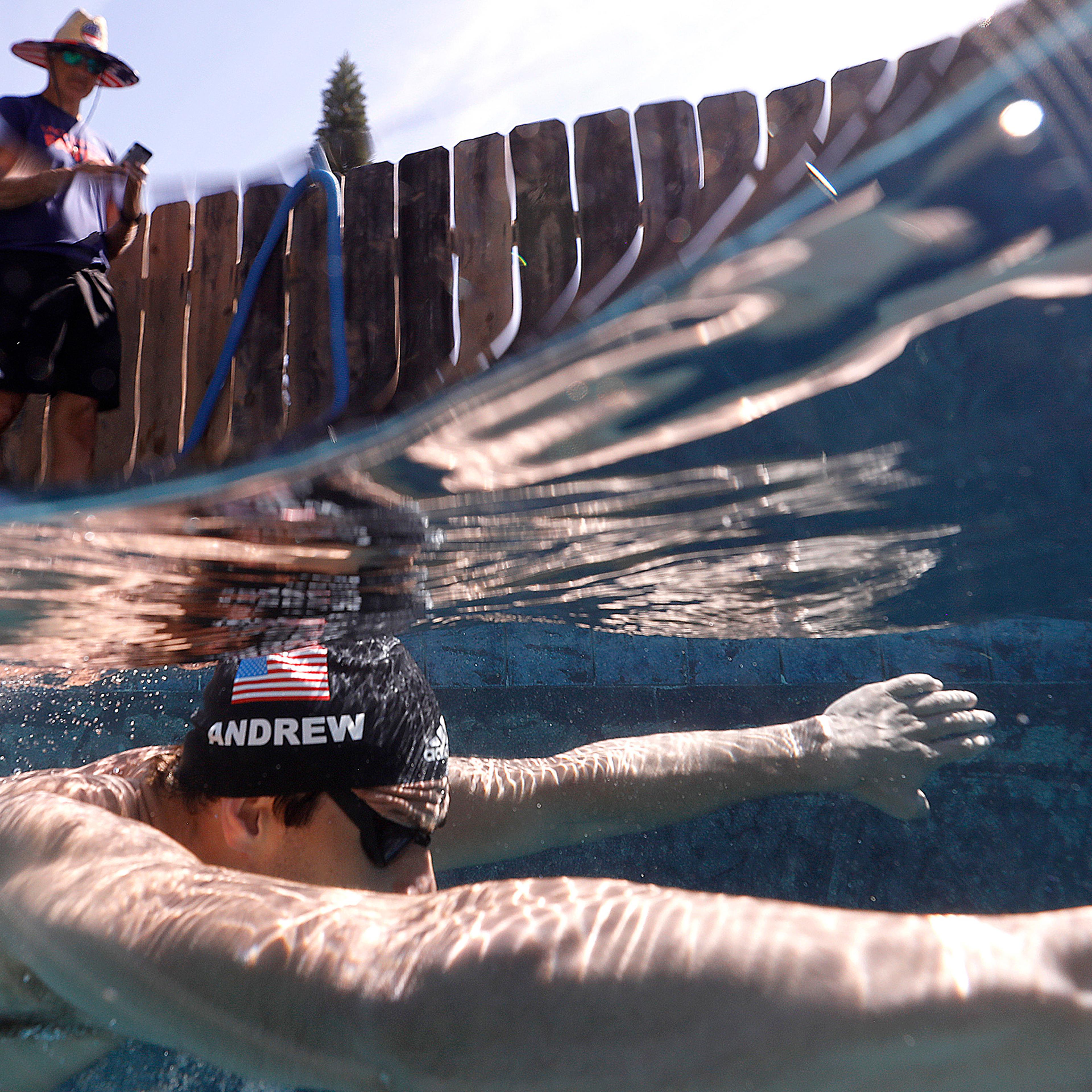 U.S. Olympic Swimmer Michael Andrew is coached by his father Peter as he trains in a residential pool in San Diego in May