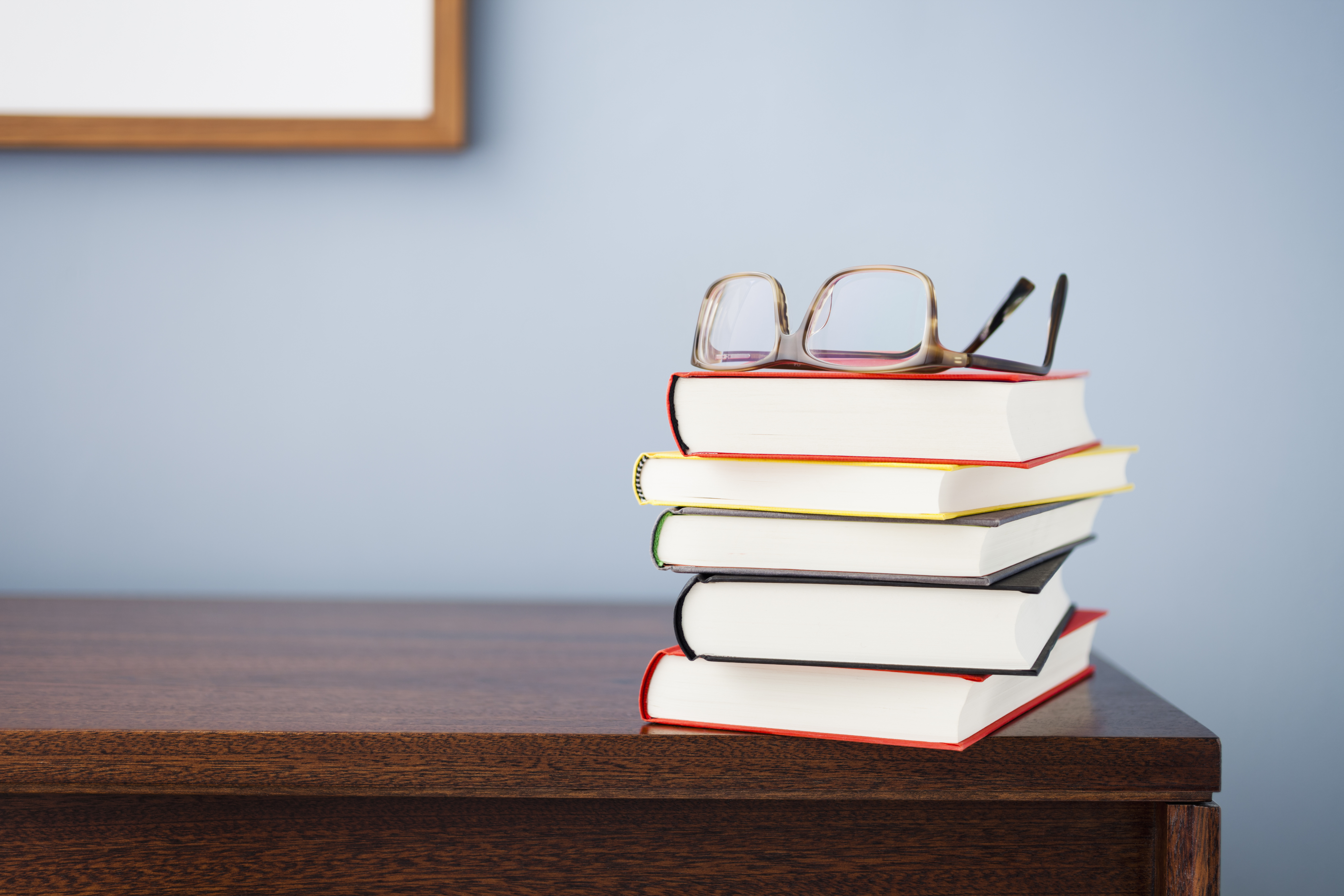 Glasses on a stack of books