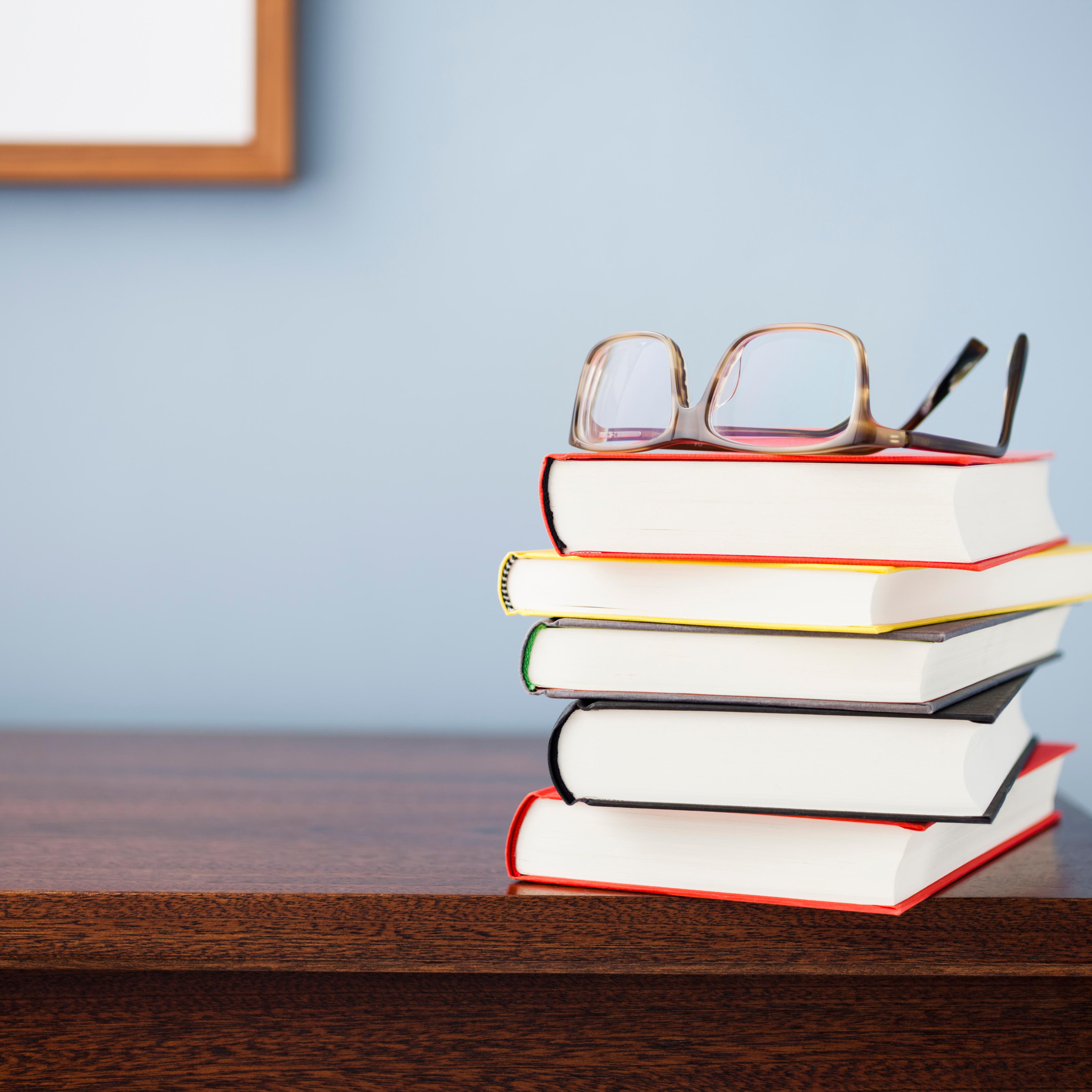 Glasses on a stack of books