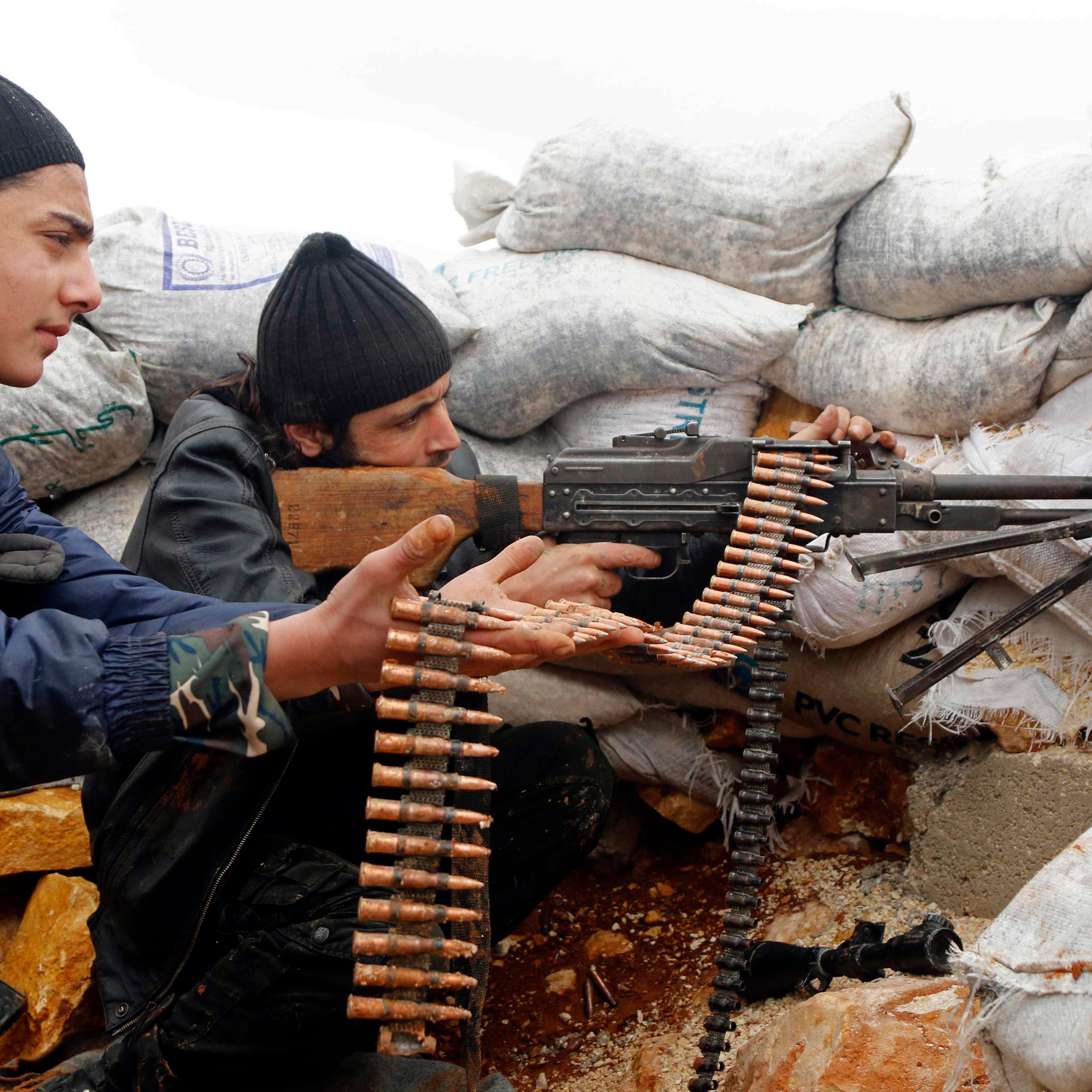 Rebel fighters fire a weapon on the al-Breij frontline, after what they said was an advance by them in the Manasher al-Hajr area where the forces of Syria's President Assad were stationed, in Aleppo