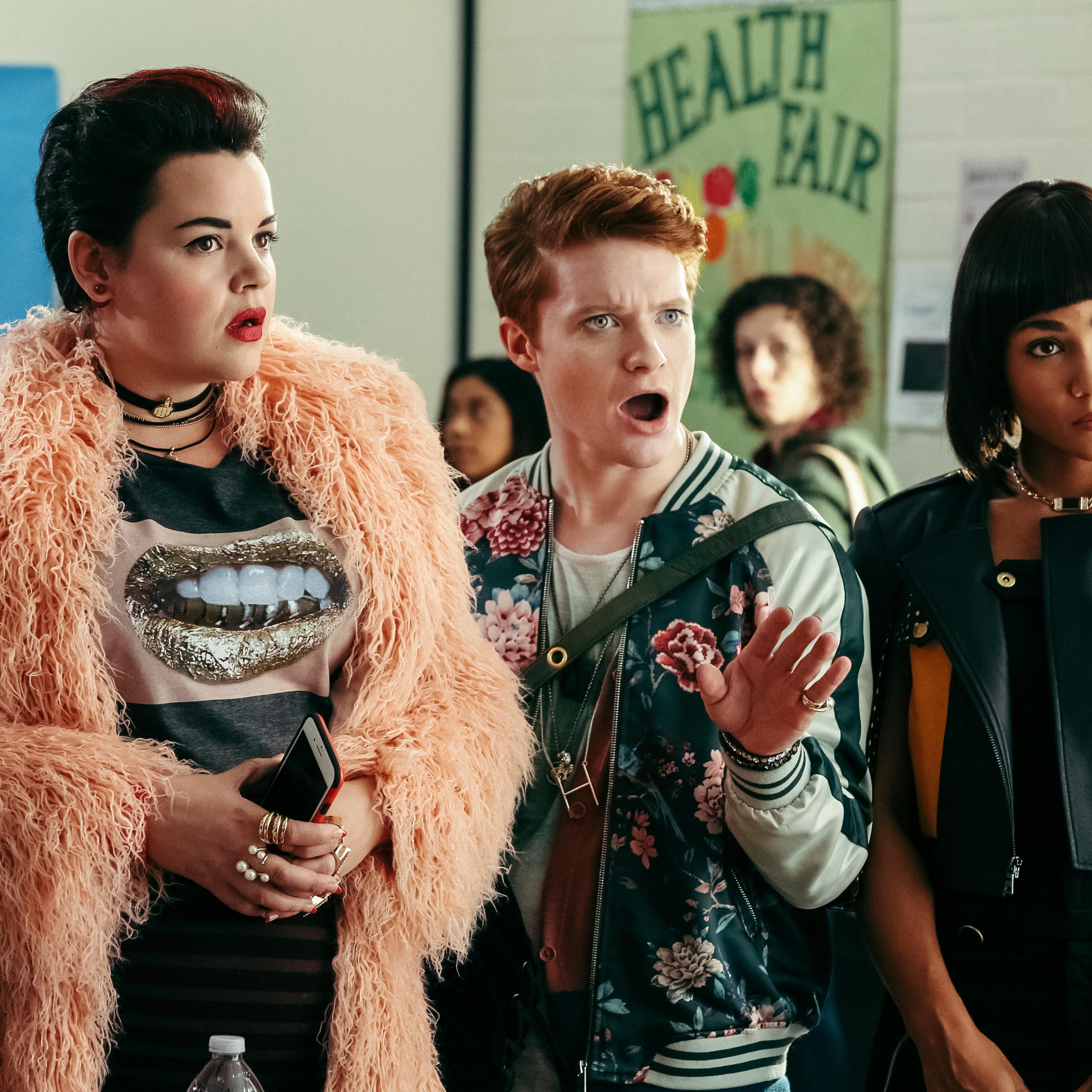 Heather Chander (l-Melanie Field) is the main "Heather" in charge at Westerburgh High. She's flanked by her Heather co-horts Heather Duke (c-Brendan Scannell) and Heather McNamara (r-Jasmine Mathews). HEATHERS is a new pitch-black comedy series based on