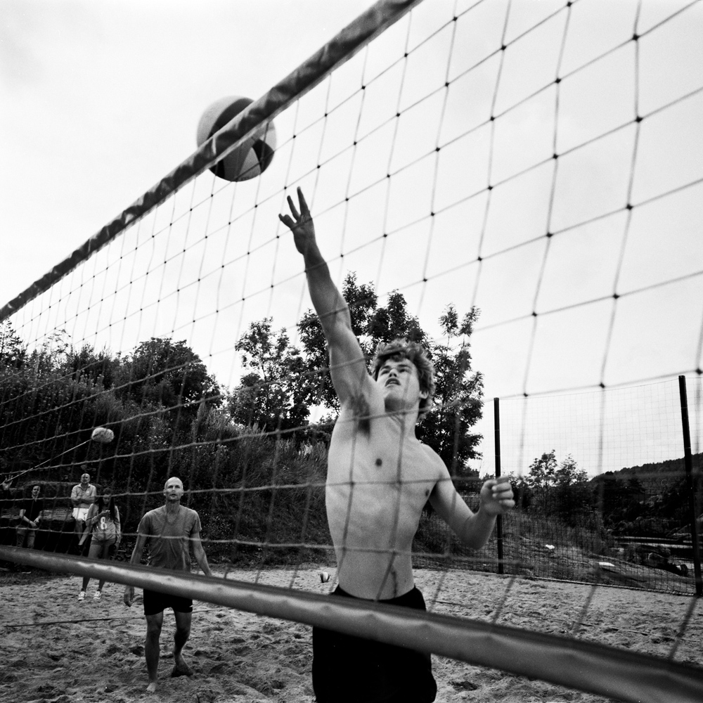 Playing beach volleyball in front of journalists
