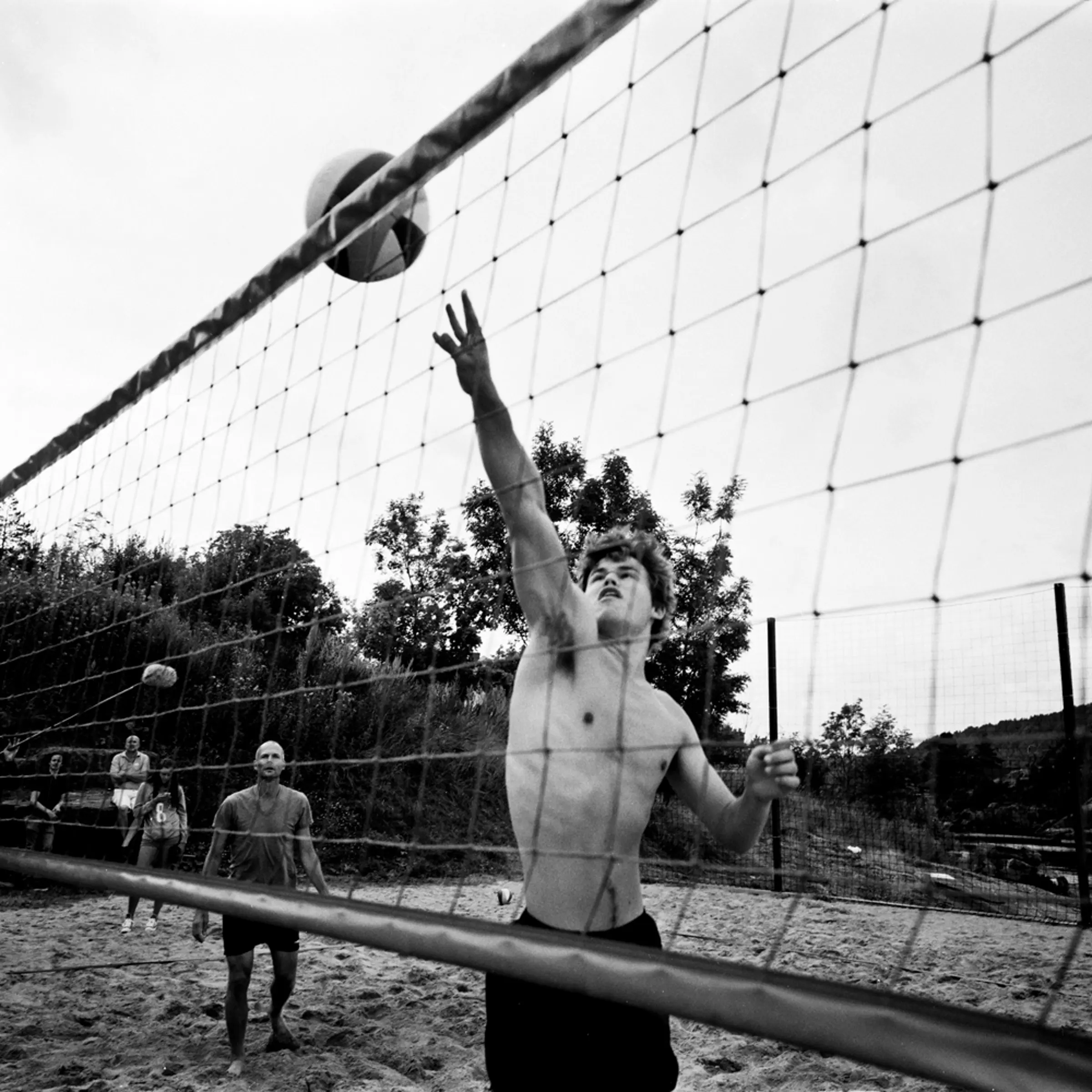 Playing beach volleyball in front of journalists