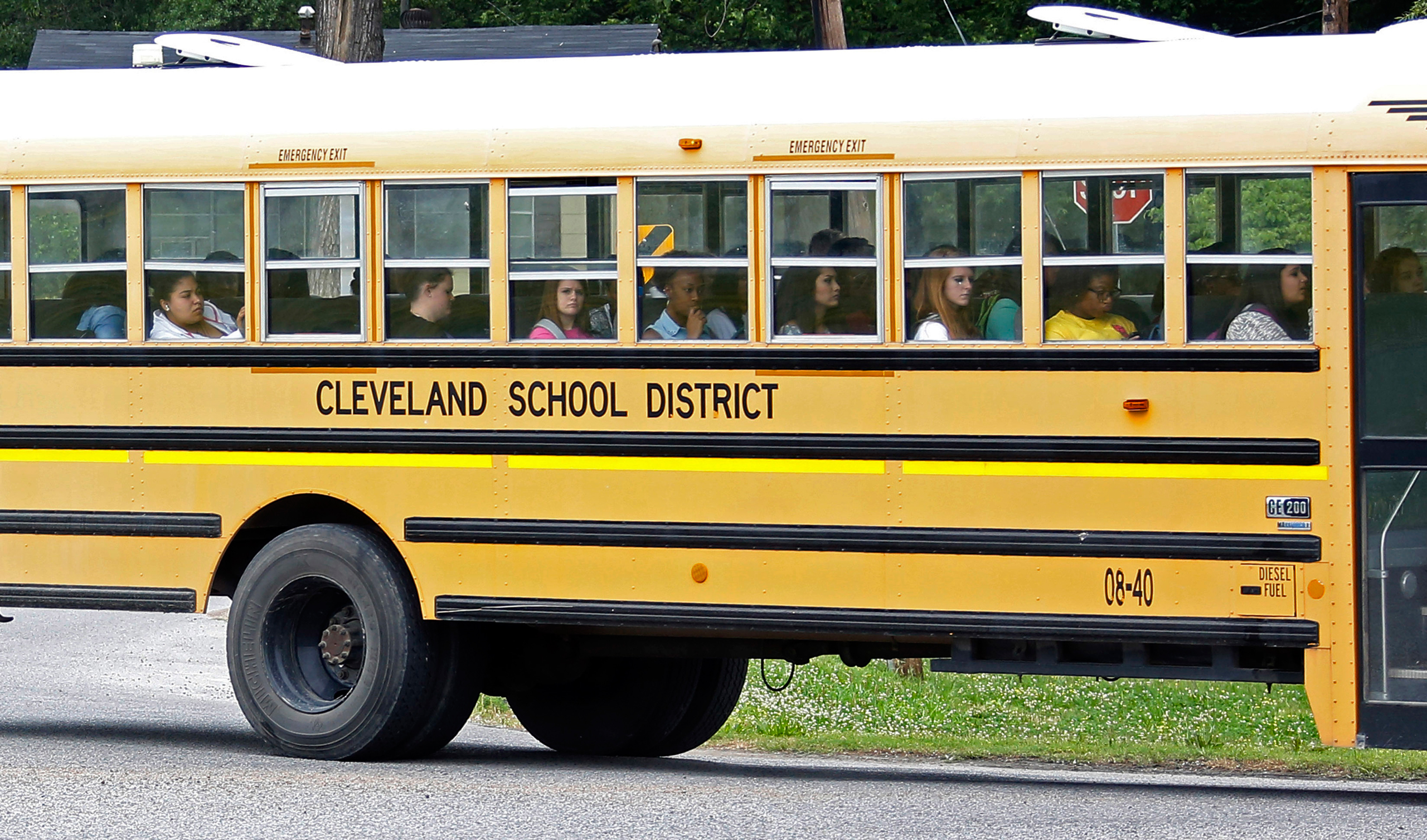 FILE- In this May 13, 2015 file photograph, an integrated group of Cleveland, Miss., public school students ride the school district bus on their way home following classes. A federal judge ruled on a desegregation case, Friday, May 13, 2016, that the Cl