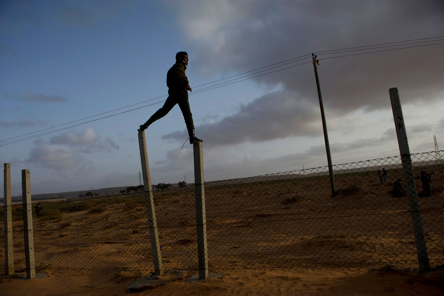 March 5, 2011. Opposition troops take positions as they push west outside of Ras Lanuf after taking the city back from troops loyal to Gaddafi in Ras Lanuf, in Eastern Libya. Dangerous confrontations have been going on between opposition forces and those loyal to Col. Gaddafi across Libya.  