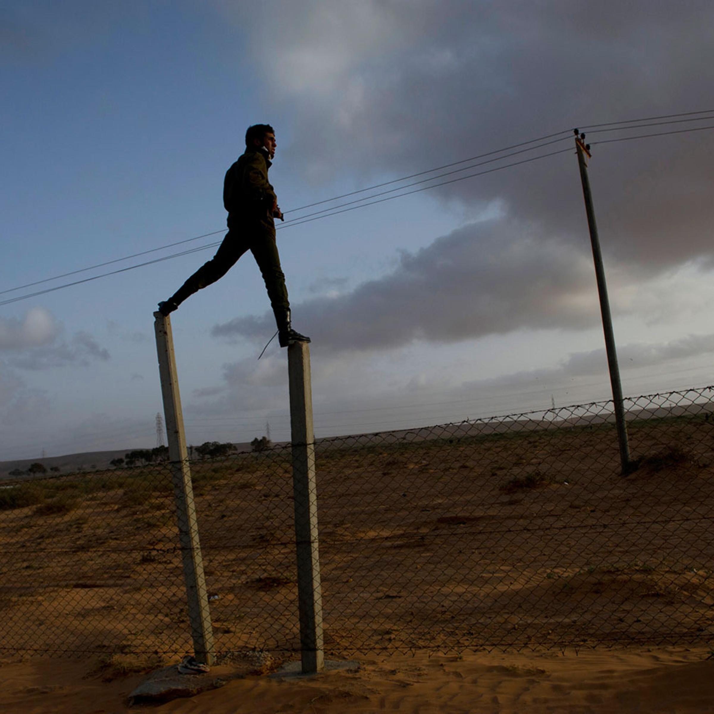 March 5, 2011. Opposition troops take positions as they push west outside of Ras Lanuf after taking the city back from troops loyal to Gaddafi in Ras Lanuf, in Eastern Libya. Dangerous confrontations have been going on between opposition forces and those loyal to Col. Gaddafi across Libya.
