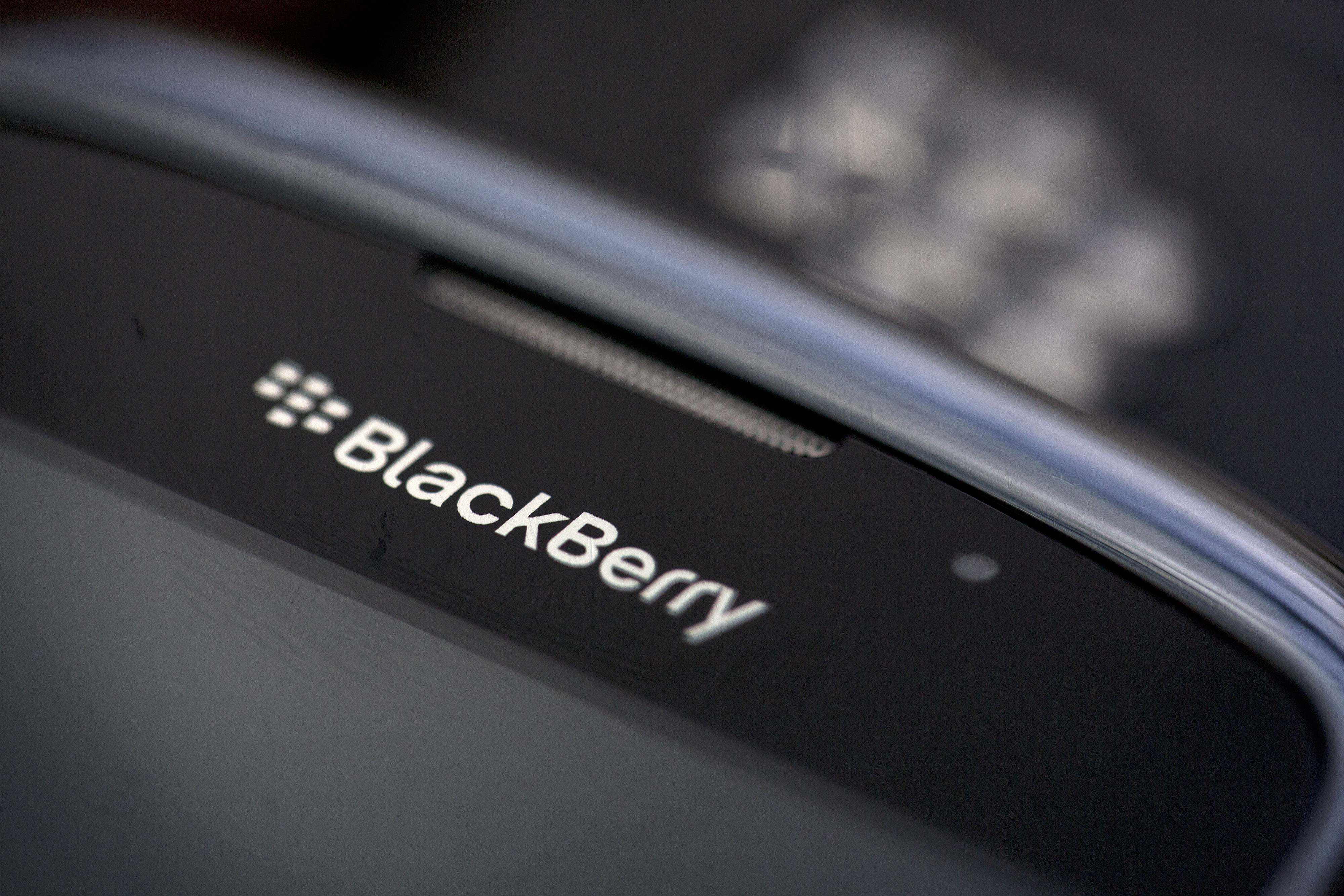 The BlackBerry logo is seen on the screen of a BlackBerry Curve smartphone, produced by BlackBerry Ltd., in this arranged photograph taken in London, U.K., on Monday, Sept. 23, 2013.