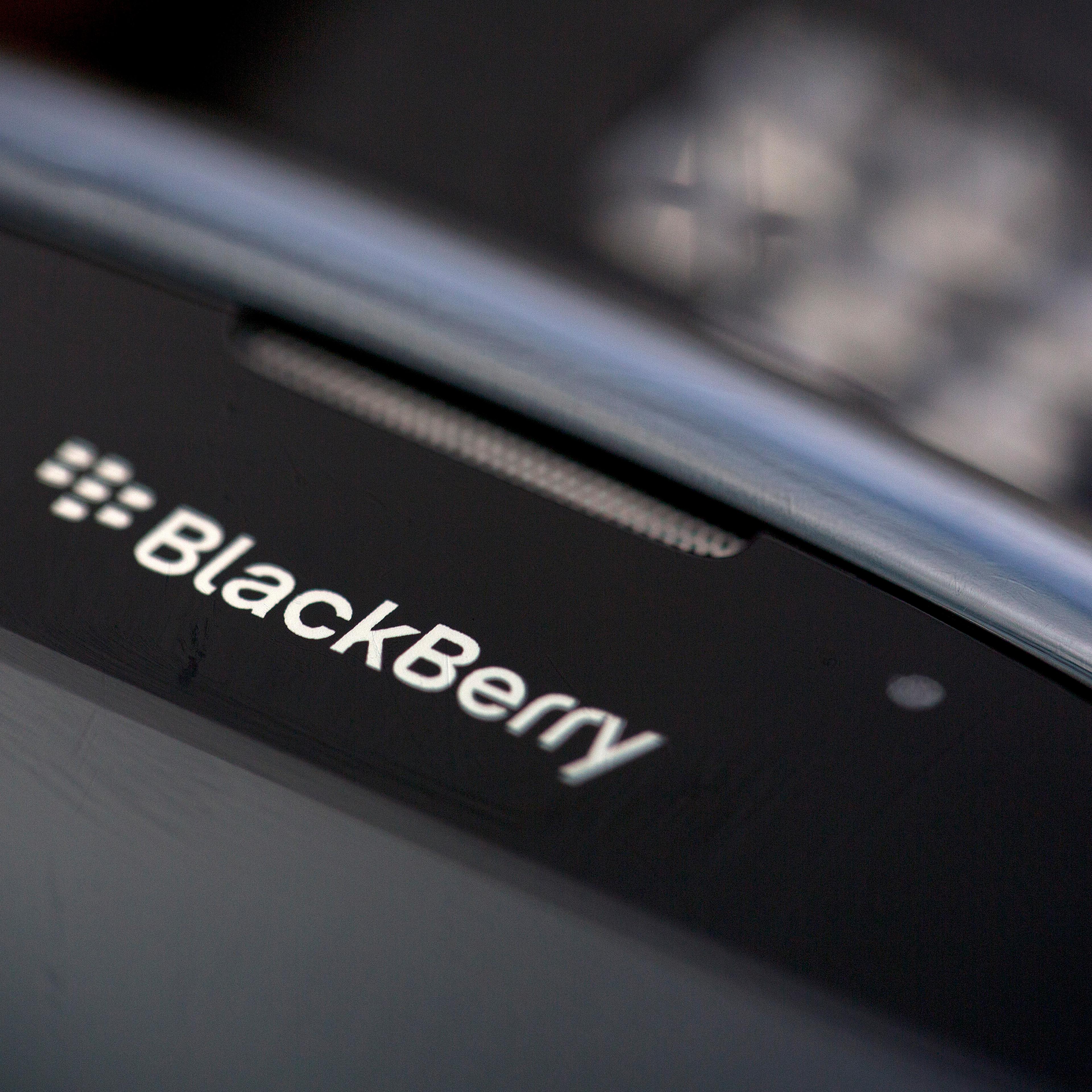 The BlackBerry logo is seen on the screen of a BlackBerry Curve smartphone, produced by BlackBerry Ltd., in this arranged photograph taken in London, U.K., on Monday, Sept. 23, 2013.