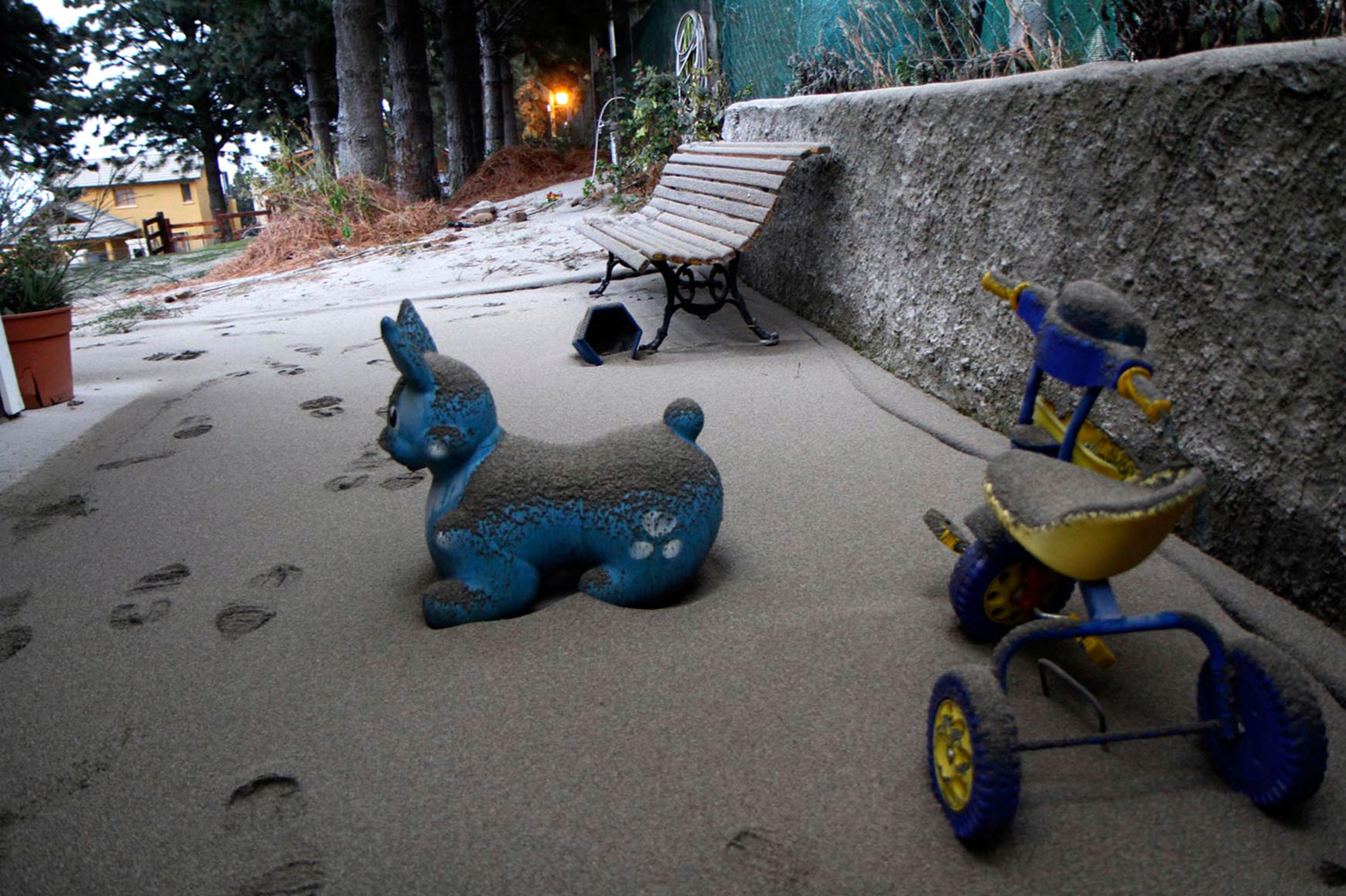 Toys covered with ash — from a volcano in the Puyehue-Cordon Caulle chain — over 100 miles away in the Argentine resort city of San Carlos de Bariloche June 5, 2011.