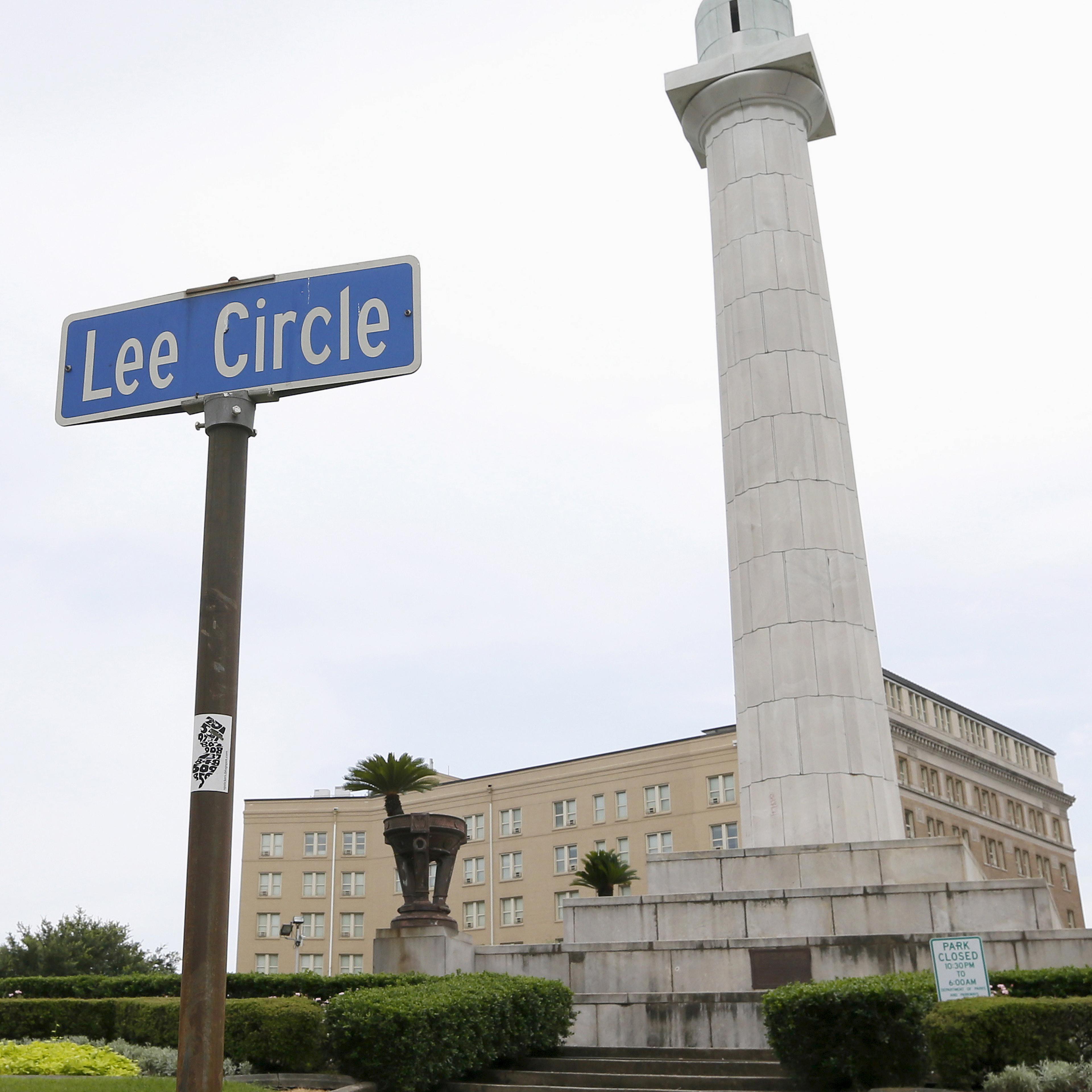 A monument to Confederate General Robert E. Lee towers over a traffic circle in New Orleans